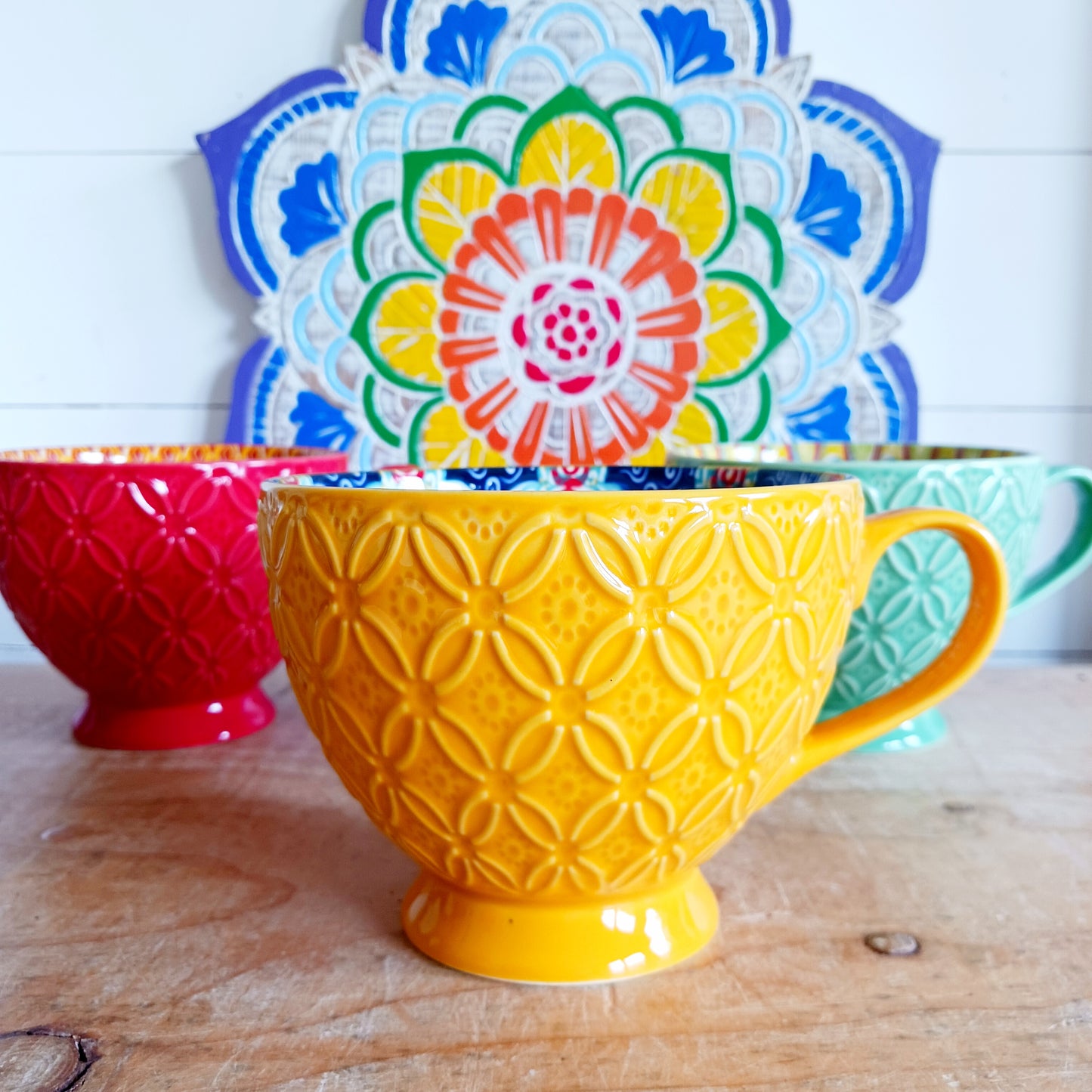 Bring Mediterranean charm to your kitchen with these beautiful Tuscany-inspired ceramic mugs. Featuring a vibrant glaze outside and embossed geometric patterns inside, they capture the rustic warmth of terracotta tiles and intricate murals found in sun-soaked Italian villages. The kaleidoscopic interiors add a burst of artistic flair, making them perfect for your morning coffee or evening tea. Stylish and versatile, these mugs are a thoughtful gift or a delightful treat for yourself.