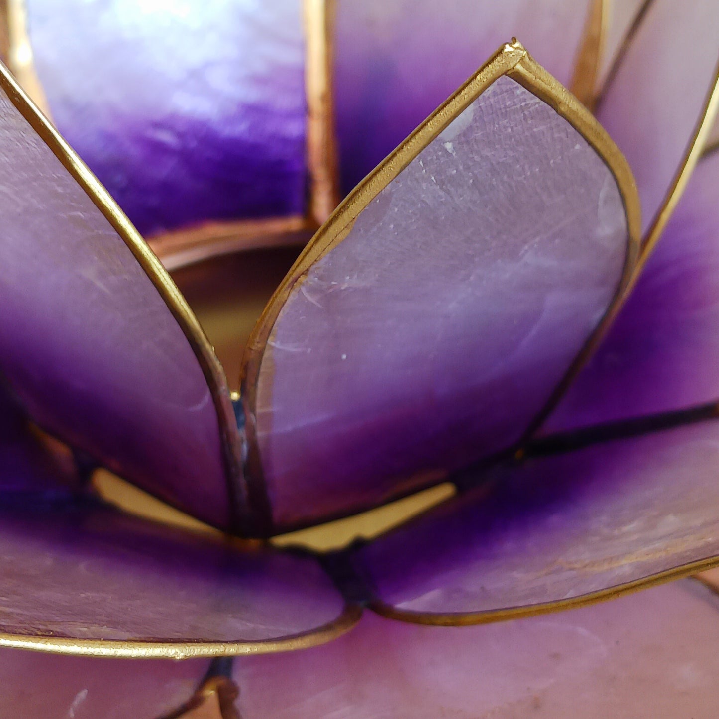 The Lotus Flower is a symbol of achieving enlightenment, peacefulness and spirituality. This beautiful candle holder can be fitted with tealight candles or slightly larger candles. The diameter of the middle is roughly 5.5cm, so it will fit any candle with the same diameter.