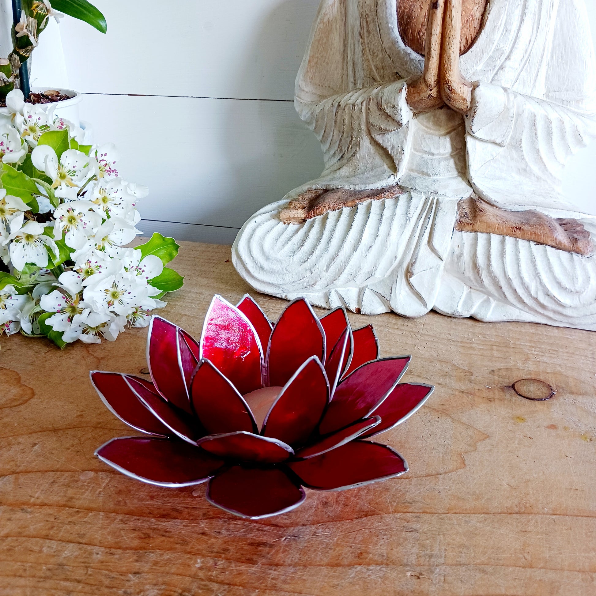 The Lotus Flower is a symbol of achieving enlightenment, peacefulness and spirituality. This beautiful candle holder can be fitted with tealight candles or slightly larger candles. The diameter of the middle is roughly 5.5cm, so it will fit any candle with the same diameter.