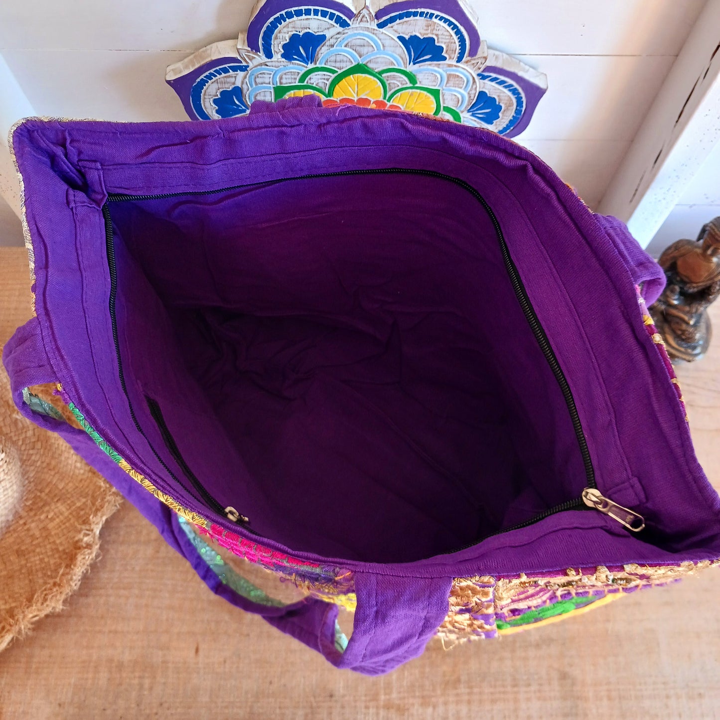 This beautiful large Indian bag comes with a wide shoulder strap and plenty of space inside for your personal items. In a patchwork style design, this bag is intricately embroidered with a traditional bohemian pattern. The bag is fully lined throughout.