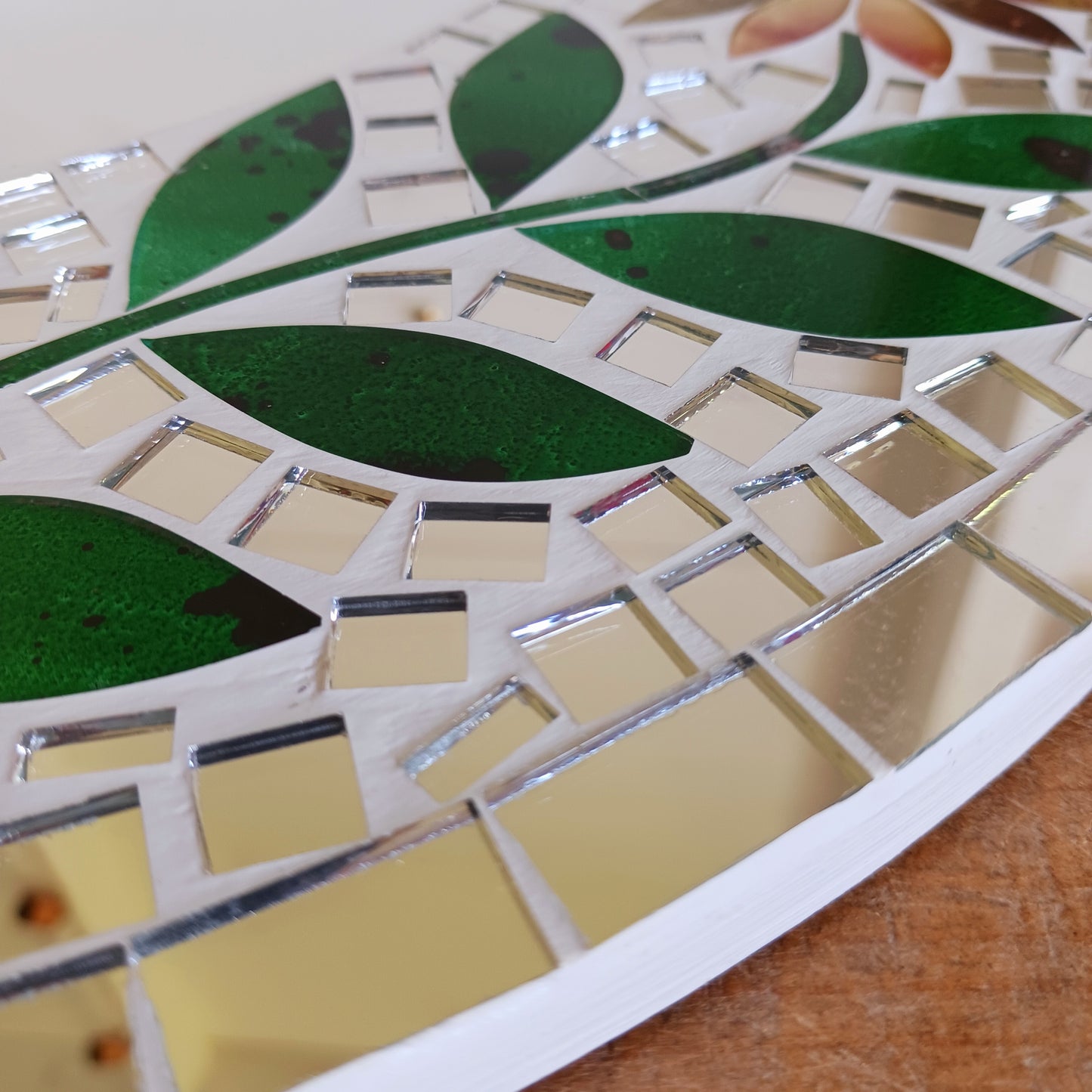 Transform any room into a vibrant oasis with our large Handmade Mosaic Floral Mirror. Crafted with care, this stunning mirror features a bright floral mosaic design that instantly adds style and colour to your décor. Perfect as a statement piece for living rooms, bedrooms, hallways, or entryways, it reflects not only light but also personality. Each mirror is uniquely handmade, making it a one-of-a-kind addition to your home.