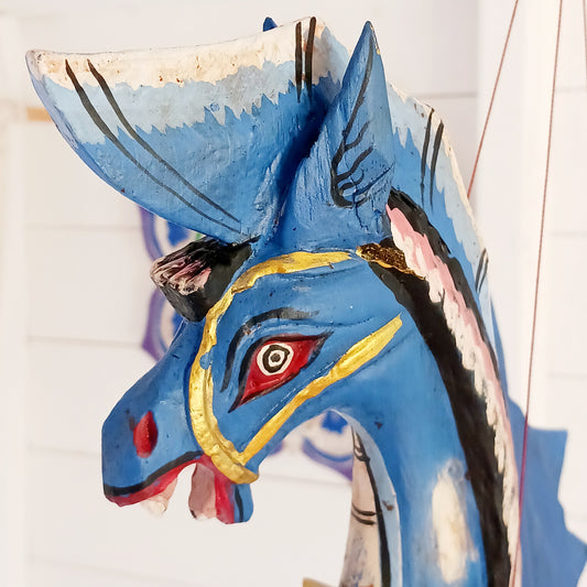 Bring a touch of fantasy to your home with this beautifully handcrafted winged seahorse hanging mobile. Hand-painted in vivid cobalt blue, this enchanting wooden seahorse features intricate painted scales, feather-like detailing and traditional Balinese-inspired decoration.