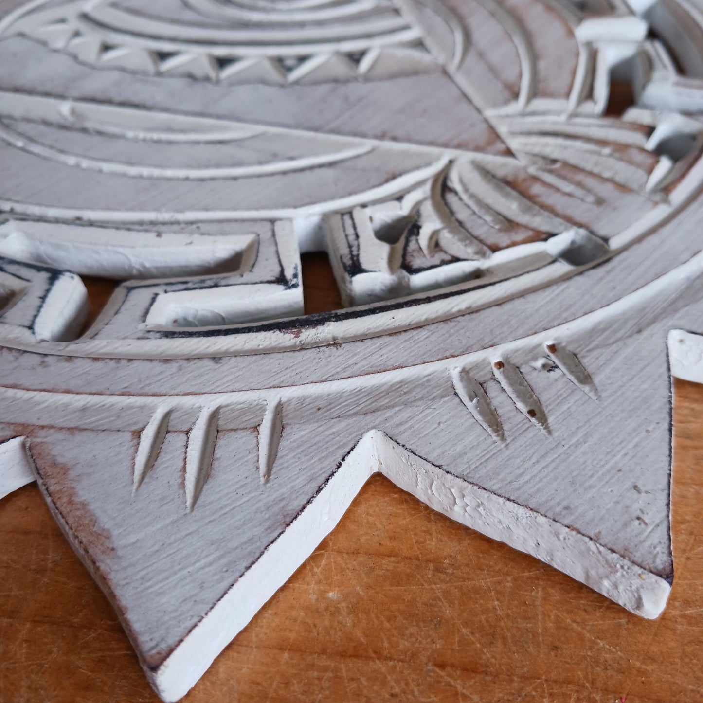 This wooden plaque has been intricately carved by hand to represent the Eye of Providence. The Eye of Providence or All-Seeing Eye is a symbol depicting an eye, often enclosed in a triangle and surrounded by a ray of light or a halo, intended to represent Providence, as the eye watches over the workers of mankind. In Christianity it serves as a reminder that humanitiy's thoughts and deeds are always obserbed by God.