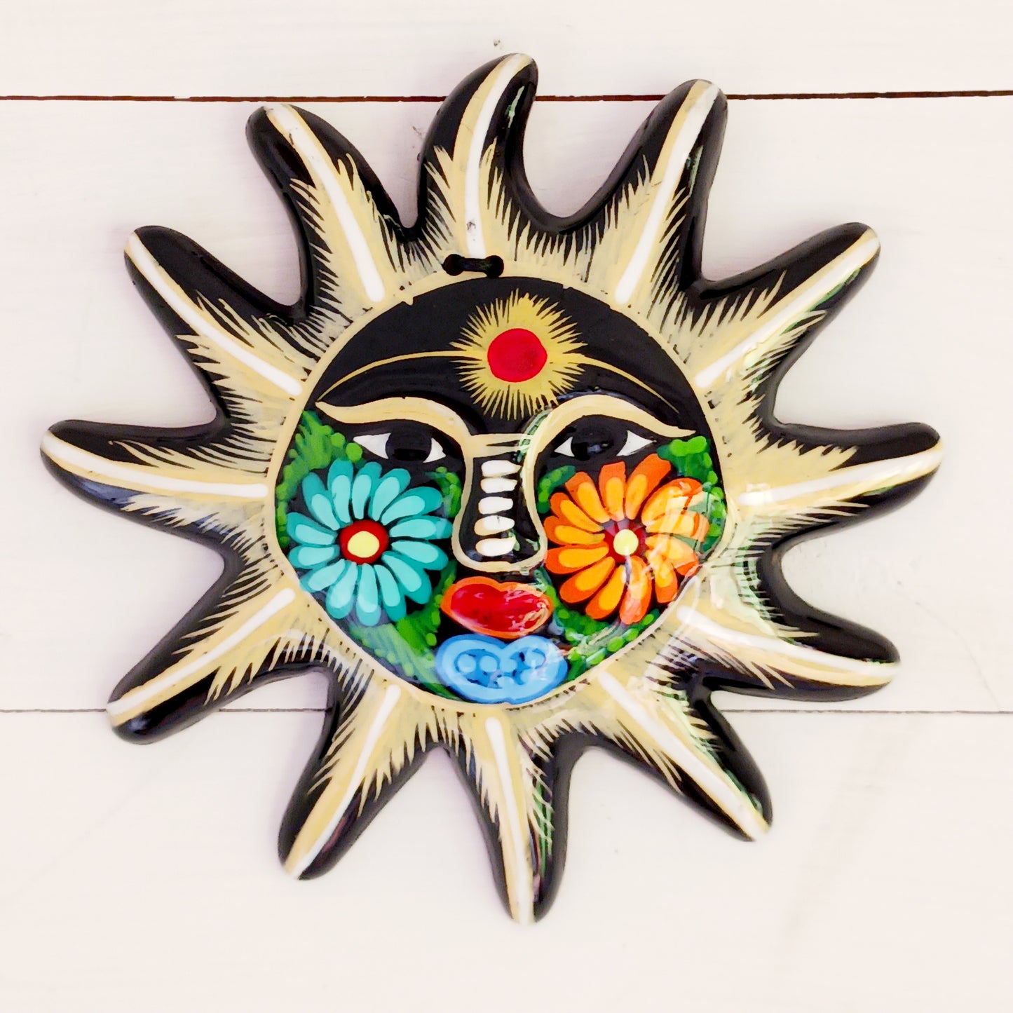 Add a burst of colour with this vibrant, hand-painted Xalitla wall plaque. Traditional Mexican folk art with a glossy finish and easy hanging design.