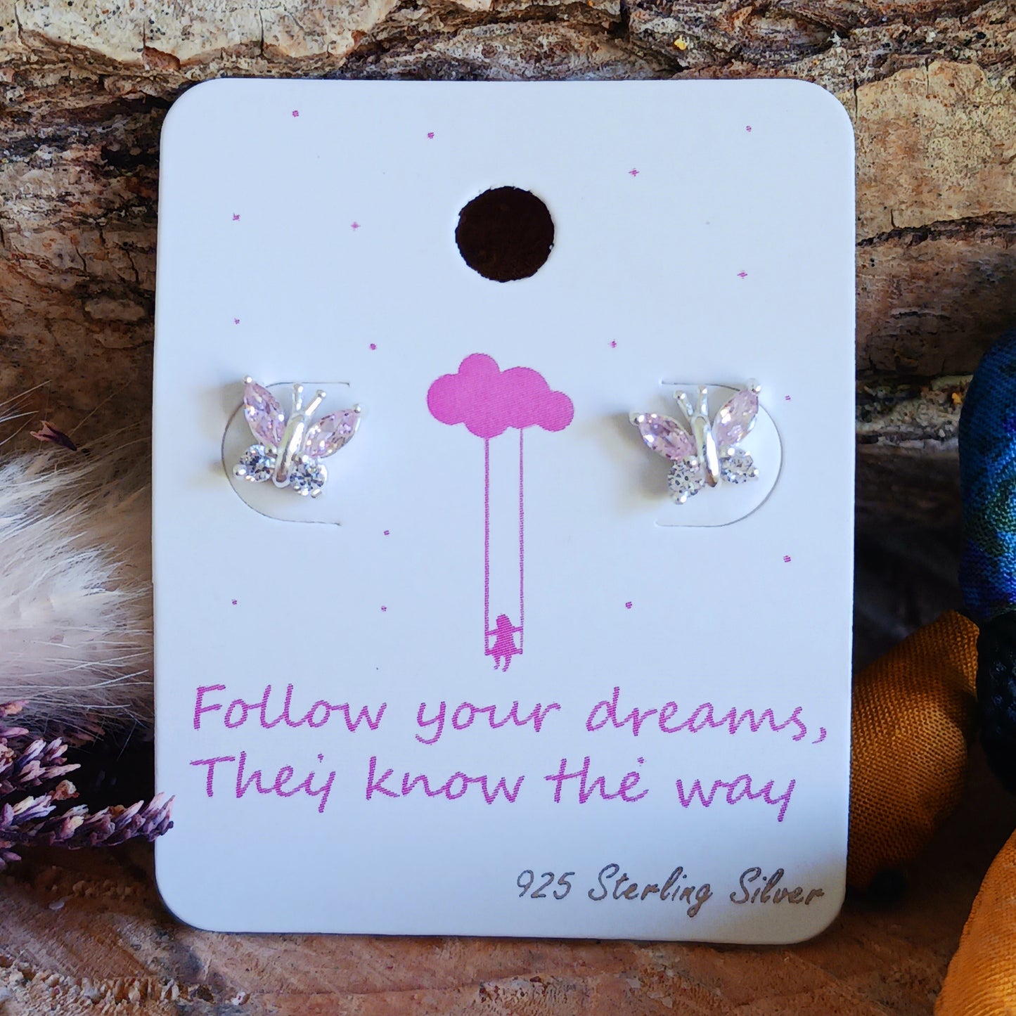 These pretty little butterfly stud earrings are 925 sterling silver, decorated with 8 cubic zirconia stones and part coloured in a baby pink pastel shade. These cute and delicate earrings are a perfect gift for family and loved ones.