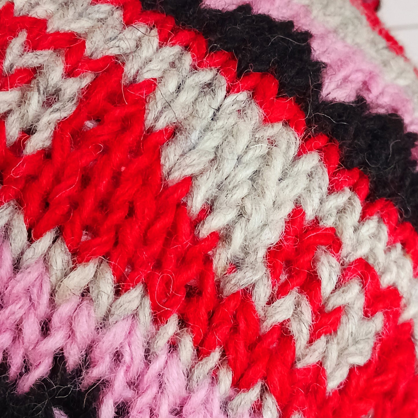 Stay cozy and stylish with our handmade chunky wool earflap hats, crafted in Nepal by skilled women artisans in Kathmandu. Each hat is 100% pure wool and features a soft polar fleece lining for extra warmth and comfort. Perfect for cold winter days, outdoor adventures, or adding a touch of handmade charm to your look.