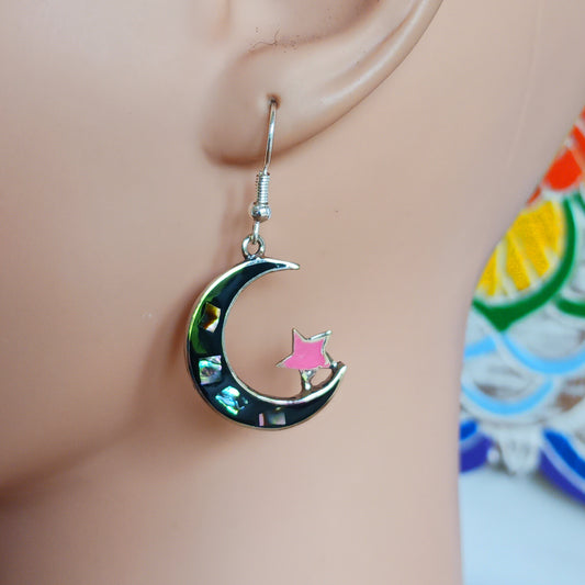 These lovely abalone Mexican earrings are crafted to show a moon and stars design. Our Mexican earrings are produced by hand in the picturesque town of Taxco using sustainable abalone shell.