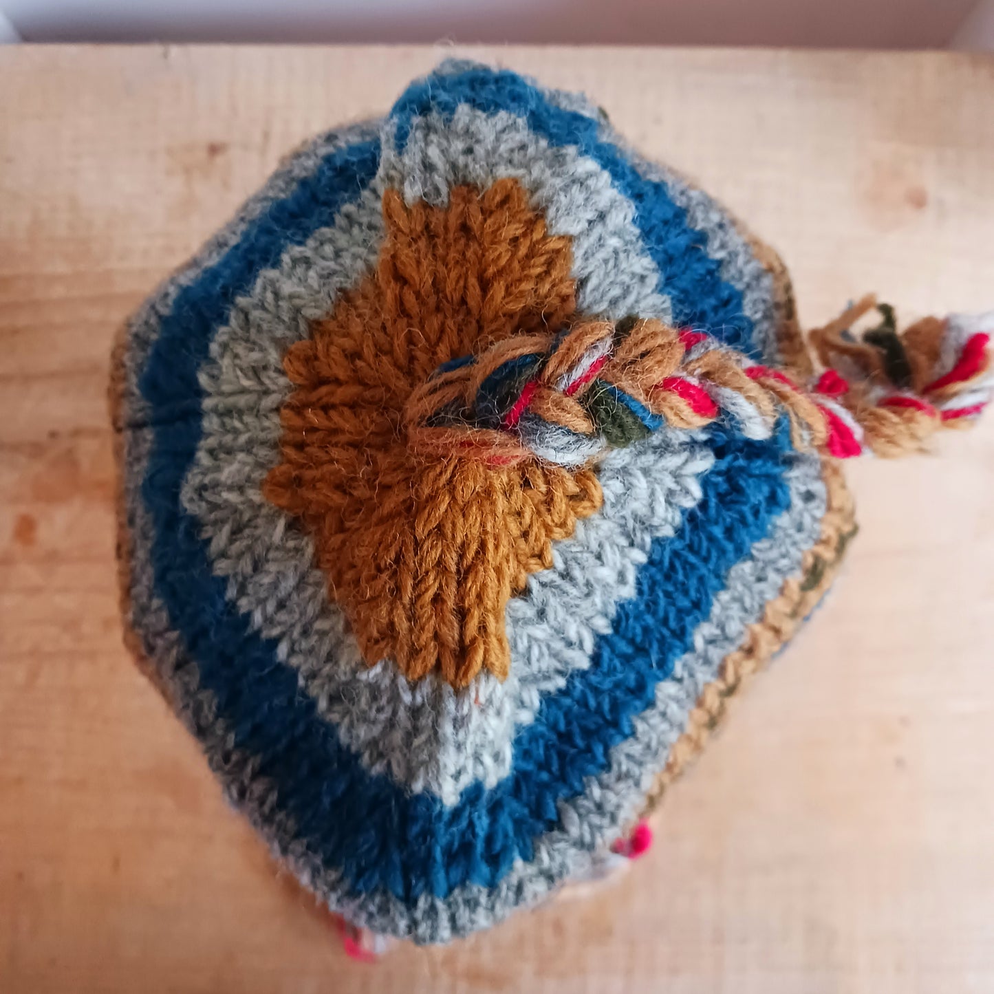 Stay cozy and stylish with our handmade chunky wool earflap hats, crafted in Nepal by skilled women artisans in Kathmandu. Each hat is 100% pure wool and features a soft polar fleece lining for extra warmth and comfort. Perfect for cold winter days, outdoor adventures, or adding a touch of handmade charm to your look.