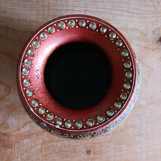 Add timeless character to your home with this beautifully crafted vintage-style wooden decorative pot. Featuring an intricate hand-painted design in rich, warm tones, this ornamental piece is elevated with a delicate gem embellishment that adds texture and visual interest.
