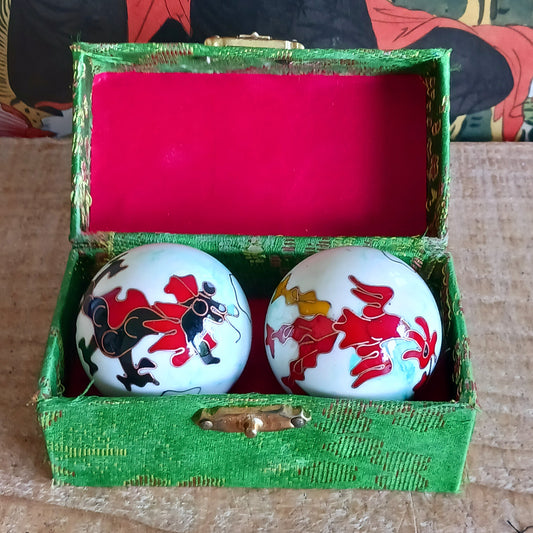 Boost hand flexibility and focus with Chinese Health Balls. Includes 2 chime balls in a silk brocade box. Ideal for relaxation, therapy, and energy balance.