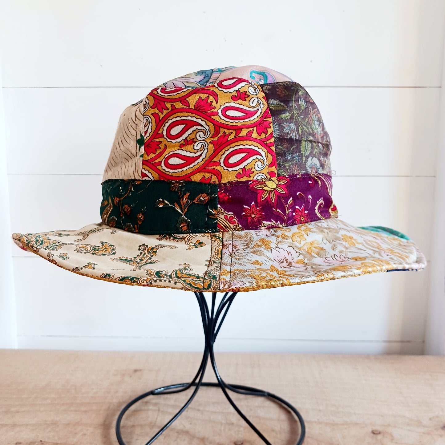 A swell little number for festivals and summer times, you'll look the coolest in this recycled sari patchwork sun hat. Black polyester lined, with a slightly flexible brim for adjusting the shape.