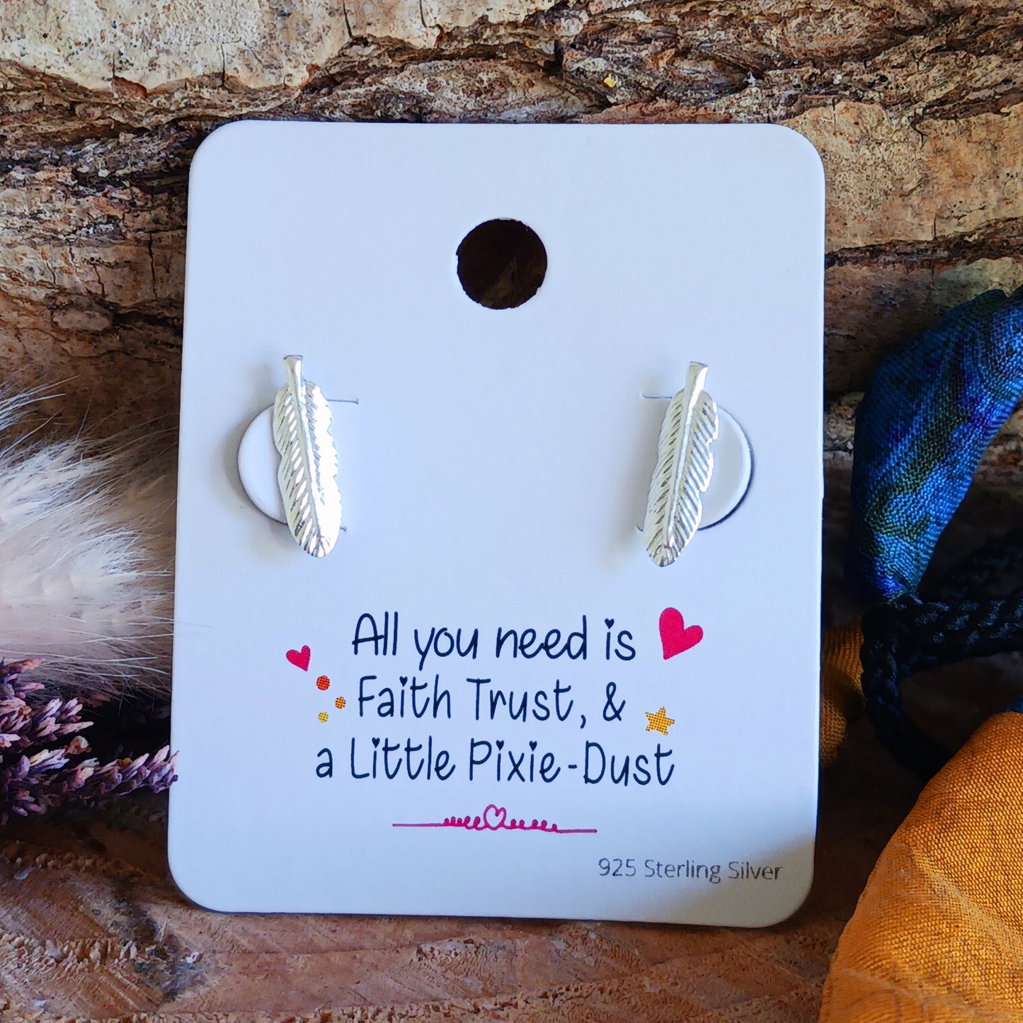 These perfectly shaped sterling silver feather stud earrings have been crafted in 925 silver with detailed barbs and rounded tip. These earrings make a subtle on-trend statement. Ideally sized to be worn alone or with 2nd or 3rd ear piercings.