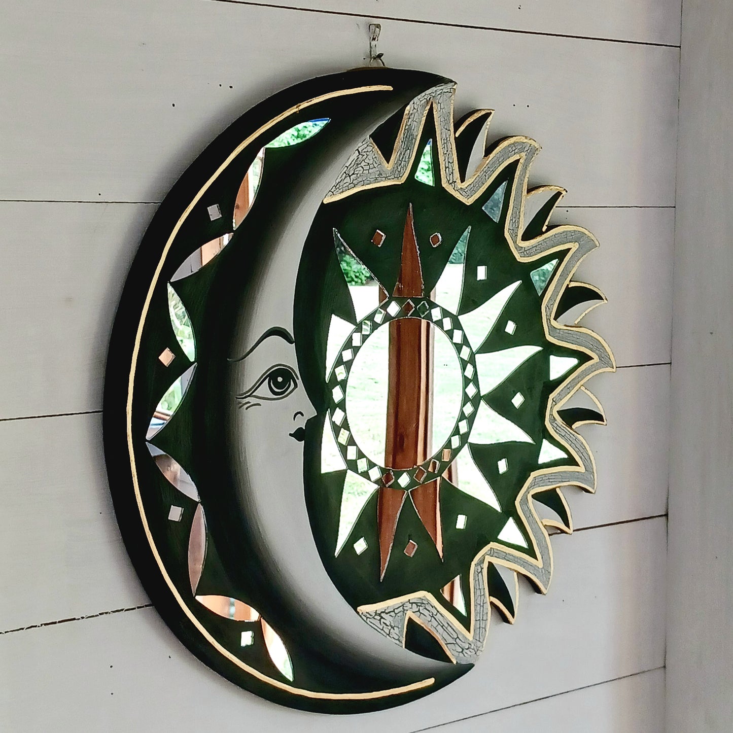 Bring the power of the sun and moon into your home with this stunning mirror. This unique eco-friendly piece allows you to express your spiritual side and add a vibrant touch to any space with silver hues echoing the brightness of solar and lunar energy. It's quirky, eclectic and great for a fresh bit of decor.