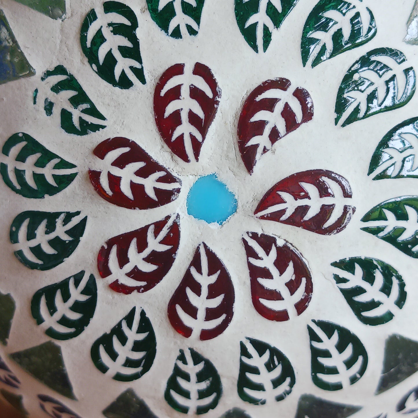These beautiful tealight holders are a mosaic mixture of pearlescent and block colours that create a vibrant floral mandala design on this glass tealight holder. Pop in a lit tealight to warm the atmosphere with multi colour vibes on outdoor summer evenings, or indoors to brighten the long dark evenings.