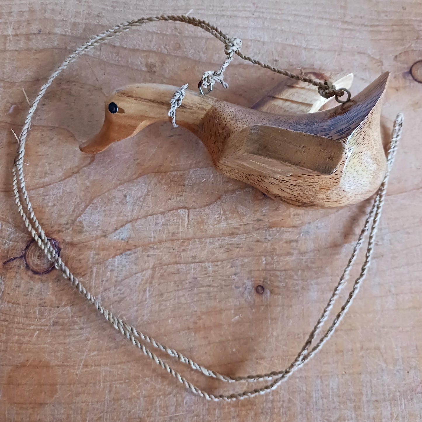 Bring a touch of whimsy and natural beauty to your home with this Handcarved Wooden Flying Duck. Each piece is meticulously crafted from solid wood, showcasing the artisan’s skill and attention to detail. The duck’s natural finish highlights the unique wood grain, adding a rustic charm that complements any interior style.