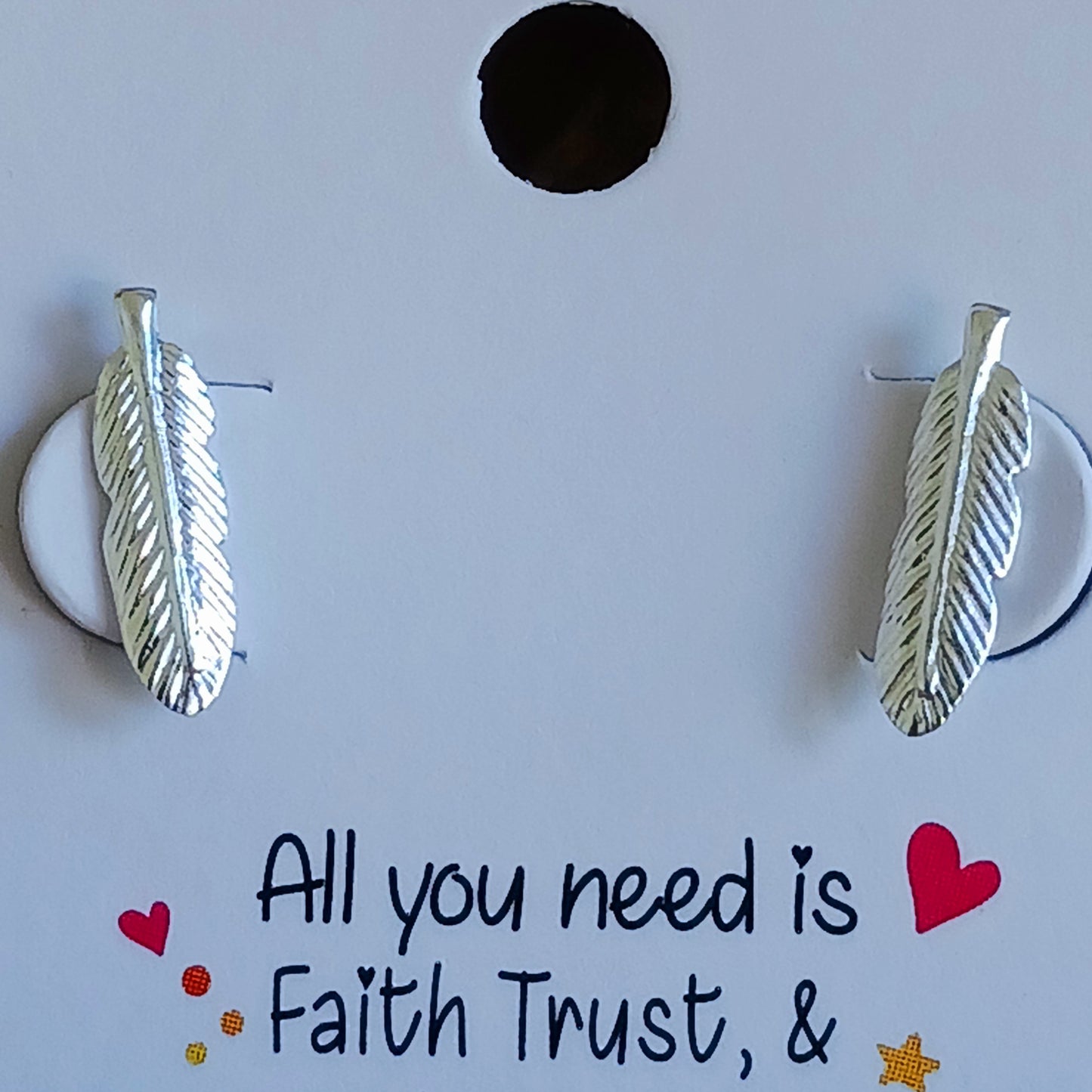 These perfectly shaped sterling silver feather stud earrings have been crafted in 925 silver with detailed barbs and rounded tip. These earrings make a subtle on-trend statement. Ideally sized to be worn alone or with 2nd or 3rd ear piercings.