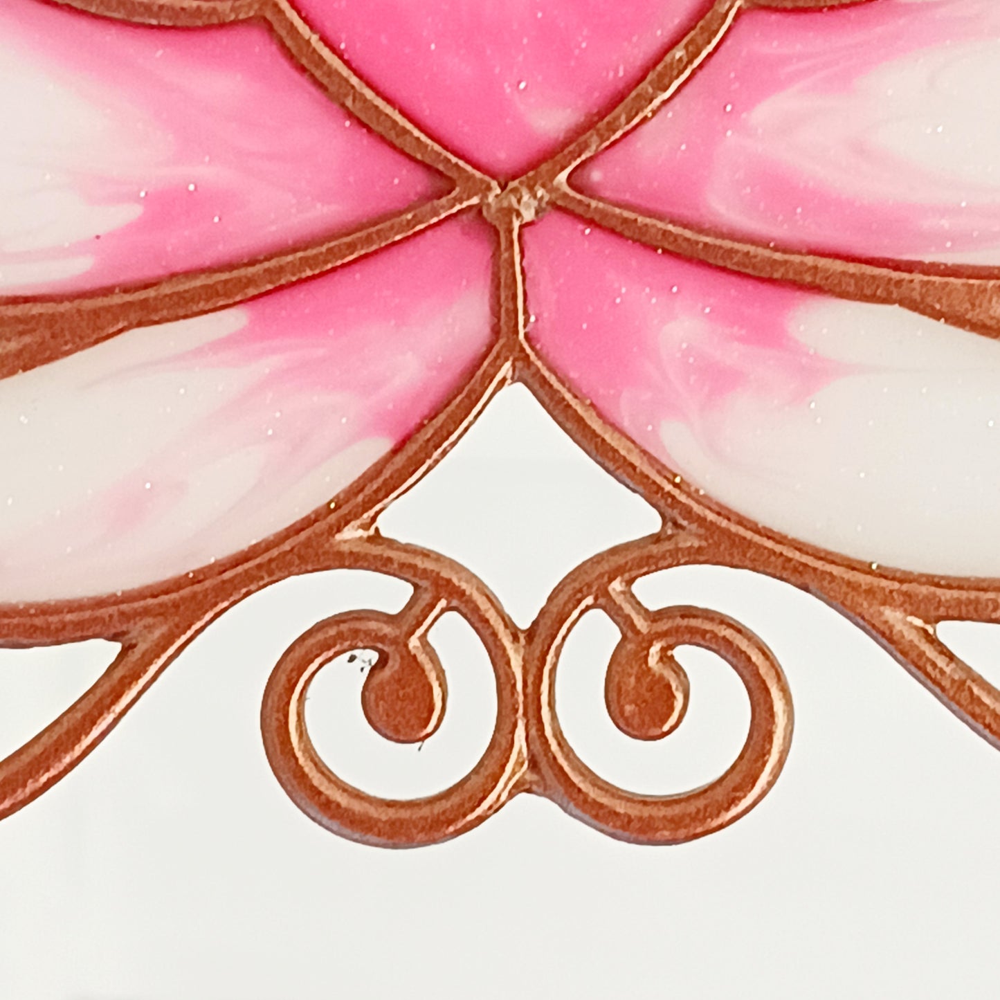 Bring a touch of tranquility to your space with this beautifully crafted lotus flower window hanger. Made from vibrant coloured glass and outlined in sleek metal framing, this piece combines simplicity and elegance. When sunlight passes through, it creates a radiant, uplifting display of color. Hang it in any window to inspire peace, mindfulness, and beauty in your home or workspace.