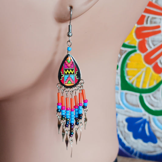 Add a touch of artisan elegance to your jewellery collection with these stunning handmade Peruvian Incan teardrop earrings. Carefully crafted in small family-run workshops in Peru, these eye-catching earrings feature traditional Incan-inspired patterns on the front with a contrasting black reverse for a striking finish.