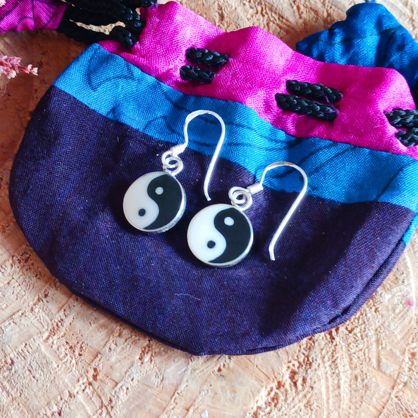 Find your perfect balance with these simple yet trendy Yin Yang dangle earrings. They are 925 sterling silver and measure 10mm x 10mm. These lovely earrings come gifted in a recycled sari gift pouch.