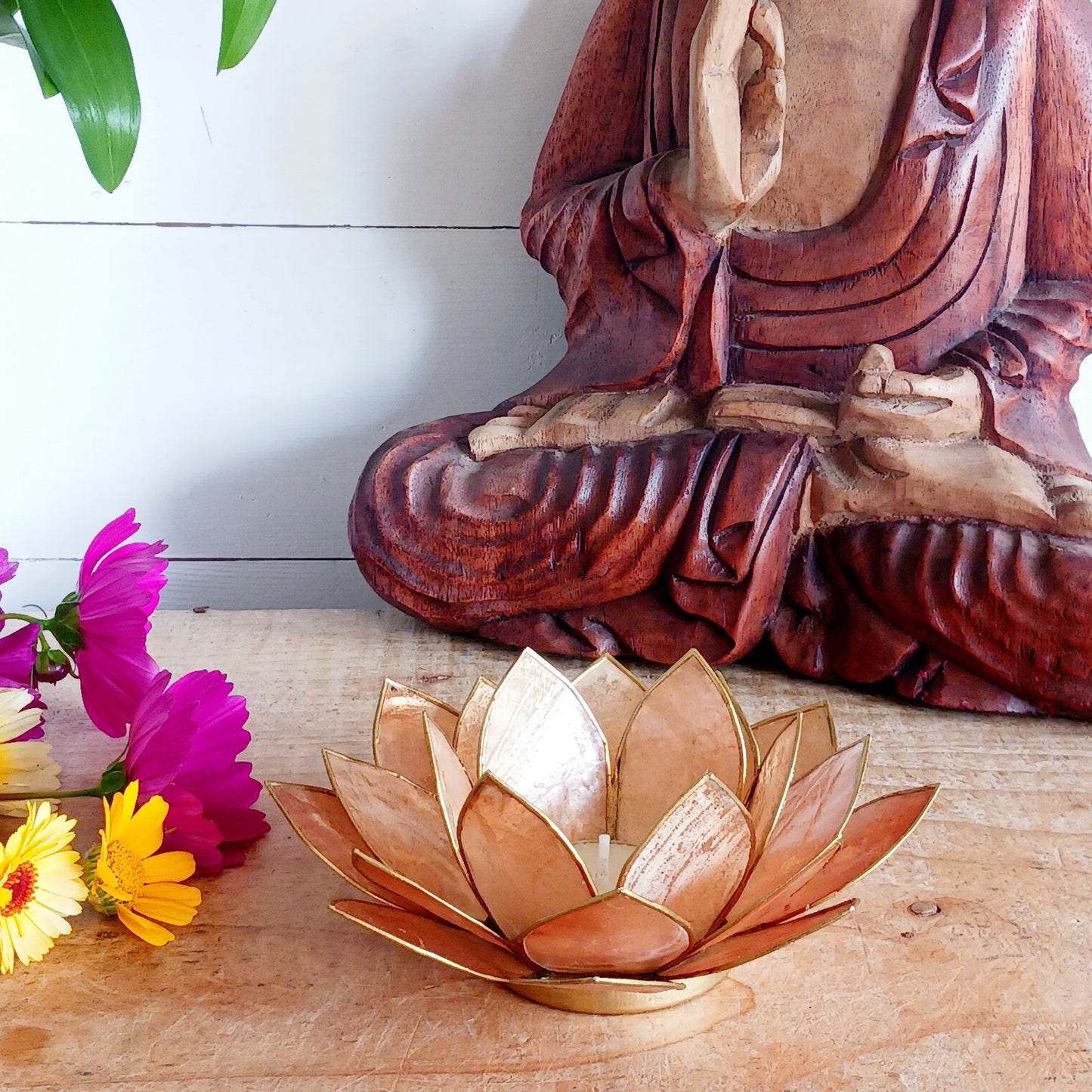Illuminate your space with the peaceful elegance of our Capiz Shell Lotus Flower Candle Holder. Symbolizing enlightenment and serenity, this stunning handcrafted piece features delicate brown coloured petals edged in gold, forming the iconic lotus shape.