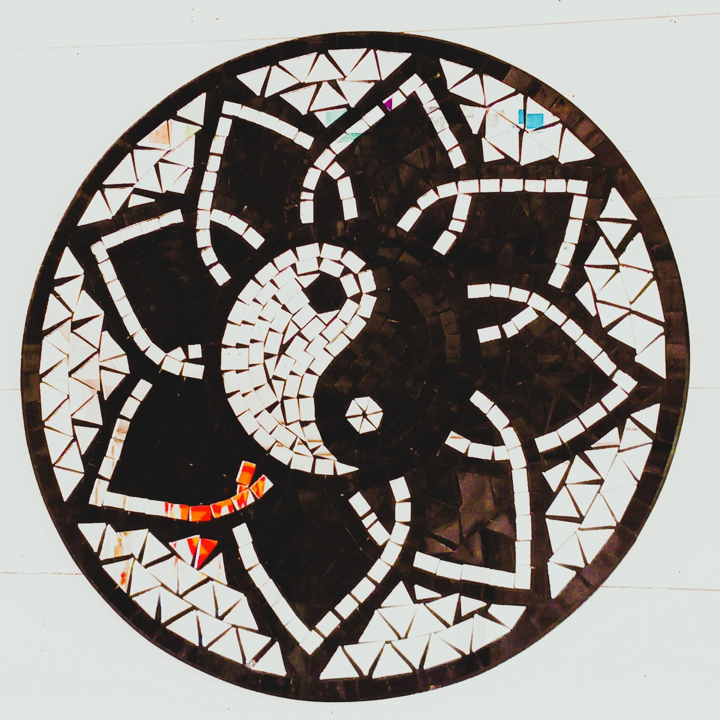 Bring balance, energy, and harmony to your space with this large handcrafted Mosaic Yin and Yang Wall Plaque. Each plaque is carefully created using small glass pieces, meticulously arranged to form a striking black and silver yin and yang design. The reflective mosaic catches the light beautifully, adding depth and elegance to any room.