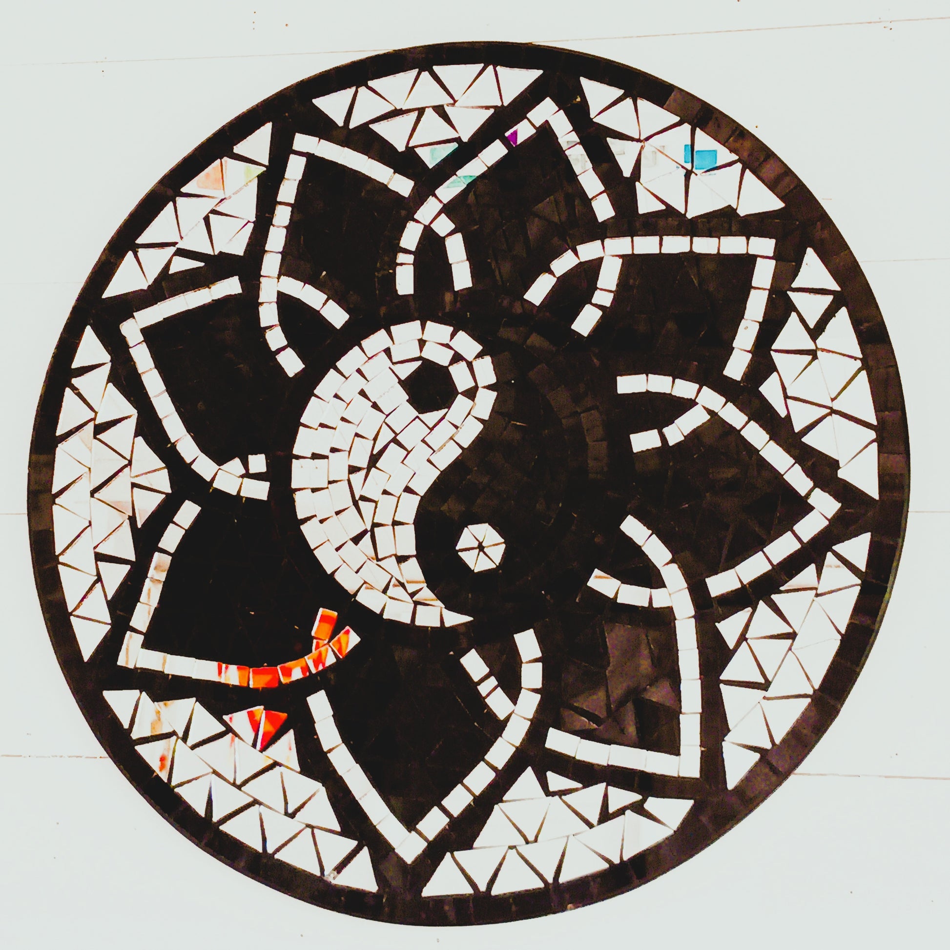 Bring balance, energy, and harmony to your space with this large handcrafted Mosaic Yin and Yang Wall Plaque. Each plaque is carefully created using small glass pieces, meticulously arranged to form a striking black and silver yin and yang design. The reflective mosaic catches the light beautifully, adding depth and elegance to any room.