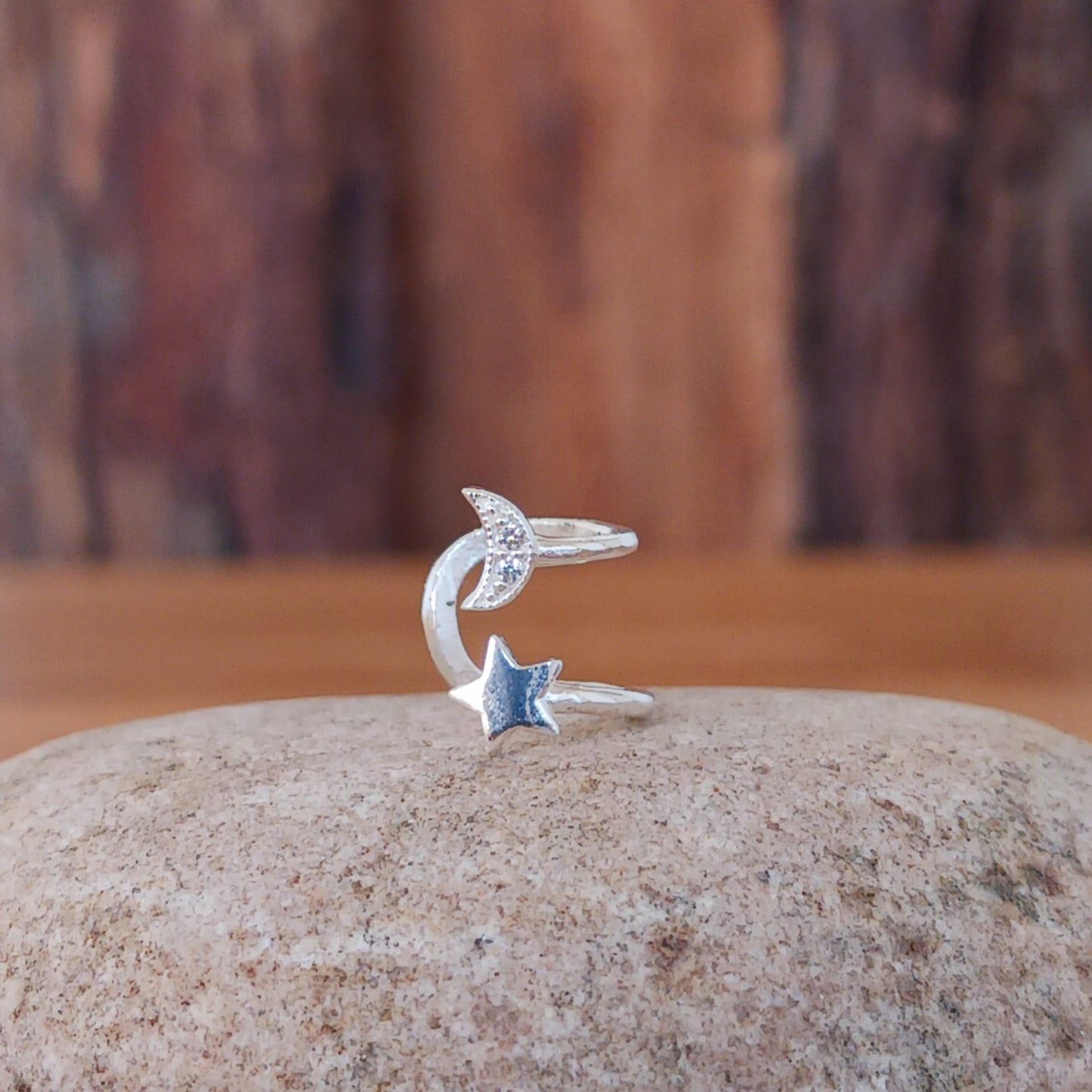 This elegant Moon & Star silver ear cuff is both delicate and charming. No piercing is required for wear, as it can be conveniently adjusted to fit your ear cartilage. An ideal accessory for individuals without pierced ears or those looking to enhance their boho style.