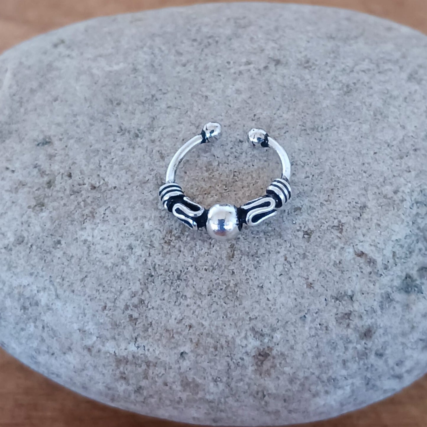 Beautiful and dainty Bali silver ear cuff. No piercing is needed to wear, it can be easily adjusted to hug your ear cartilage. Perfect for anyone who doesn't have pierced ears or if you just want to add to your boho look.