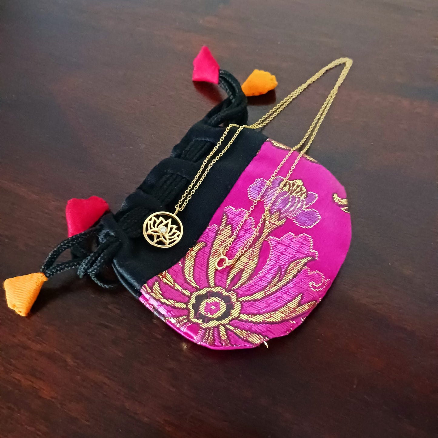This pretty Lotus Flower pendant is gold plated on 925 silver and has a tiny cz crystal at the centre. It comes on a fine gold plated on 925 silver chain. The lotus flower meaning varies from culture to culture. In general, the lotus commonly serves as a sacred for purity, rebirth, and strength. Because lotuses rise from the mud without stains, they are often viewed as a symbol of purity.