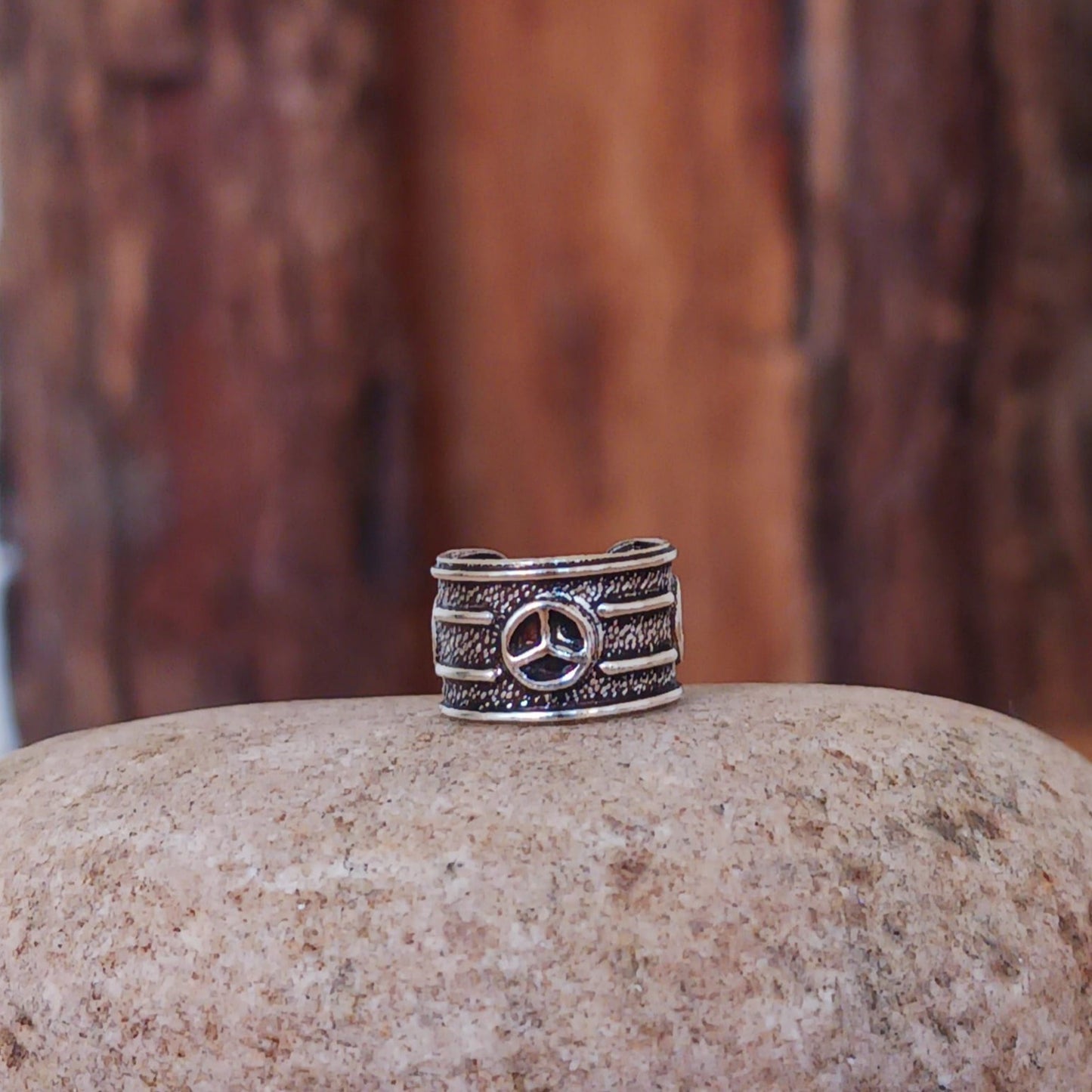 Beautiful and dainty Peace Symbol silver ear cuff. No piercing is needed to wear, it can be easily adjusted to hug your ear cartilage. Perfect for anyone who doesn't have pierced ears or if you just want to add to your boho look.
