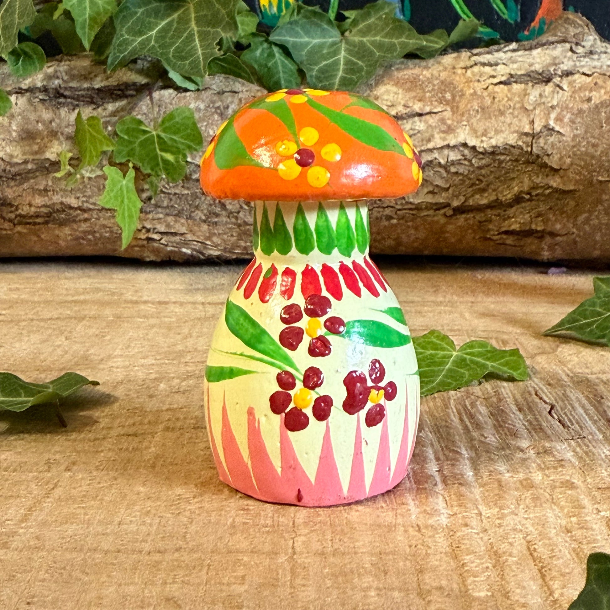 Bring a touch of nature’s charm into your home with our Hand Painted Wooden Mushroom Ornament. Each piece is lovingly crafted and painted by skilled artisans, transforming a simple wooden form into a joyful work of art. The mushroom’s delicate floral design and vibrant colours symbolise harmony, growth, and the beauty of simplicity.