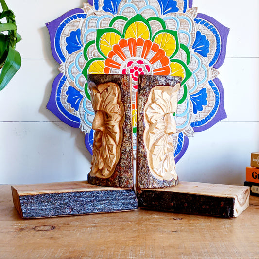Bring the magic of ancient folklore into your home with these beautifully hand-carved Green Man wooden bookends. Celebrating one of the most enduring symbols of British and European mythology, the Green Man represents nature, renewal, rebirth and the changing seasons. His expressive face emerges from a crown of intricately carved leaves, creating a striking decorative feature for any bookshelf.