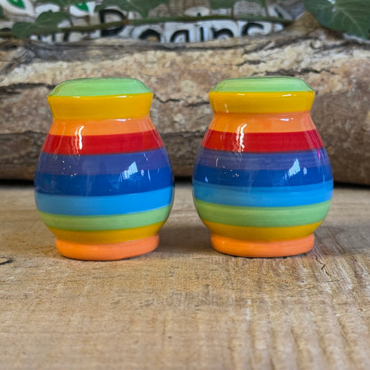 Brighten your table with our handmade rainbow stripe ceramic salt & pepper set. Fair-trade from Thailand, each unique, hand-painted piece is dishwasher and microwave safe—perfect for adding vibrant charm to your home.