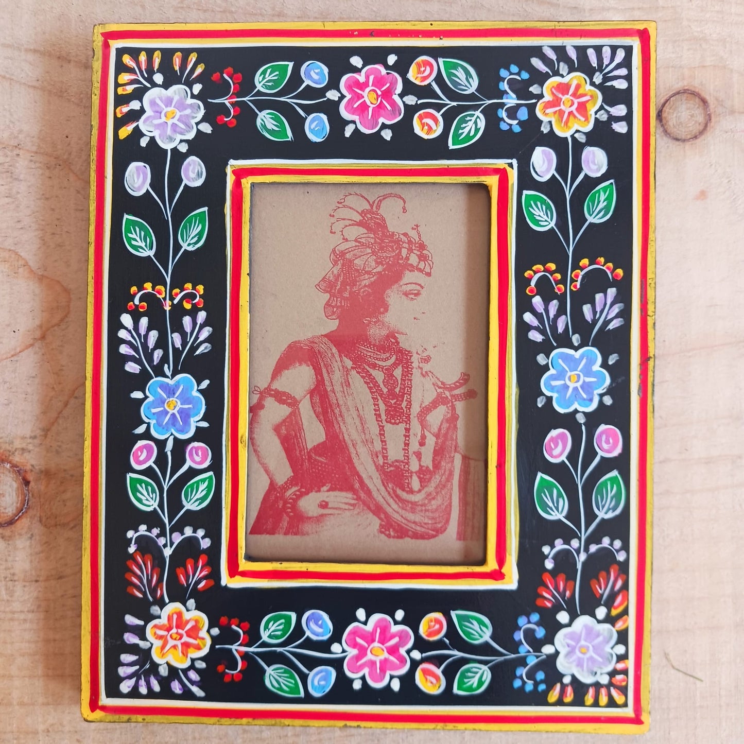 These lovely handmade wooden photo frames are made from sustainable mango wood and hand painted with floral designs. Each is decorated with vibrant flower designs in a beautiful tapestry of colour. This is impressive Indian artistry, ideal for displaying your favorite prints. Each is unique and perfect for gifting.