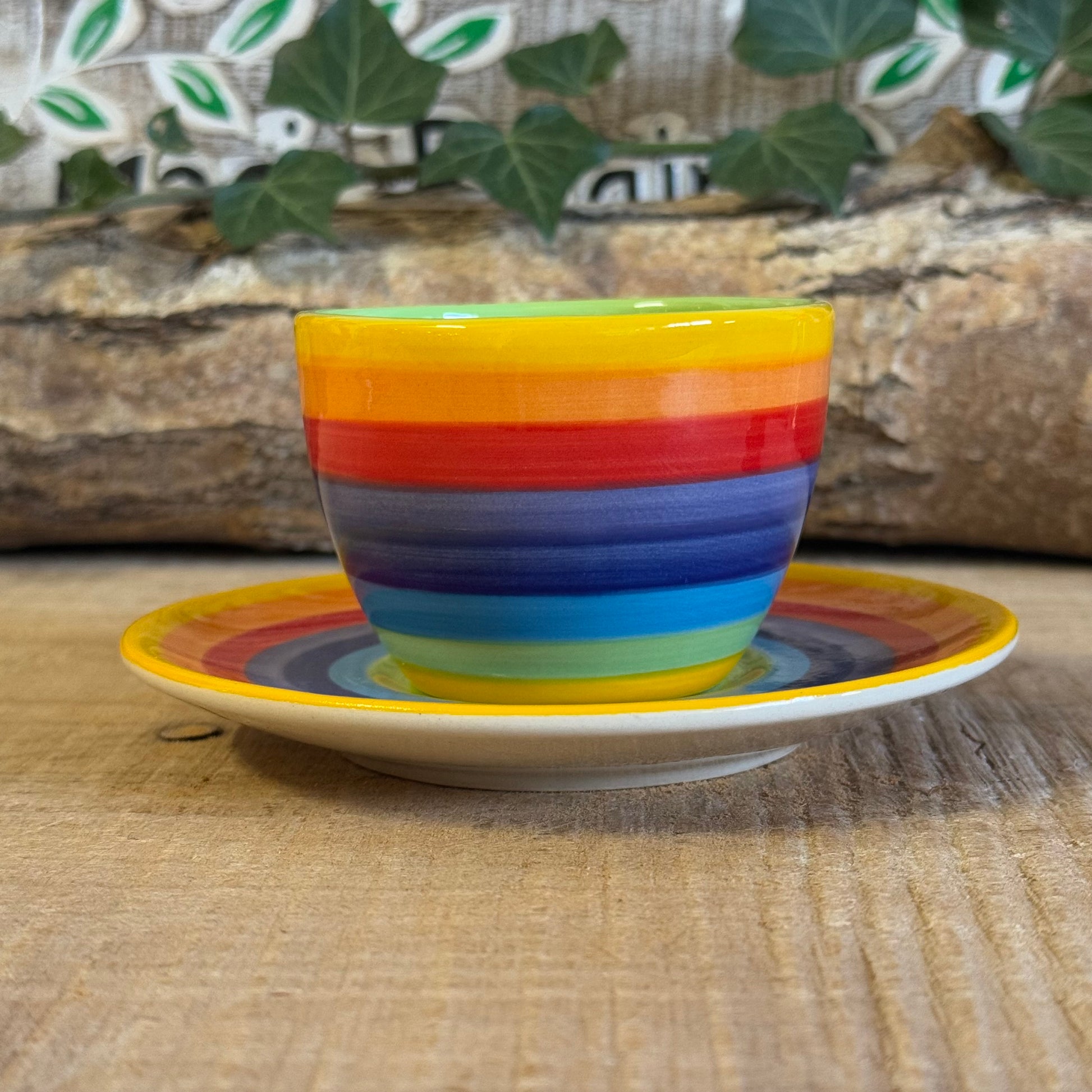 Enjoy your coffee in style with our handmade rainbow stripe ceramic cup & saucer. Fair-trade from Thailand, this vibrant, hand-painted set is dishwasher and microwave safe—perfect for brightening up any home.