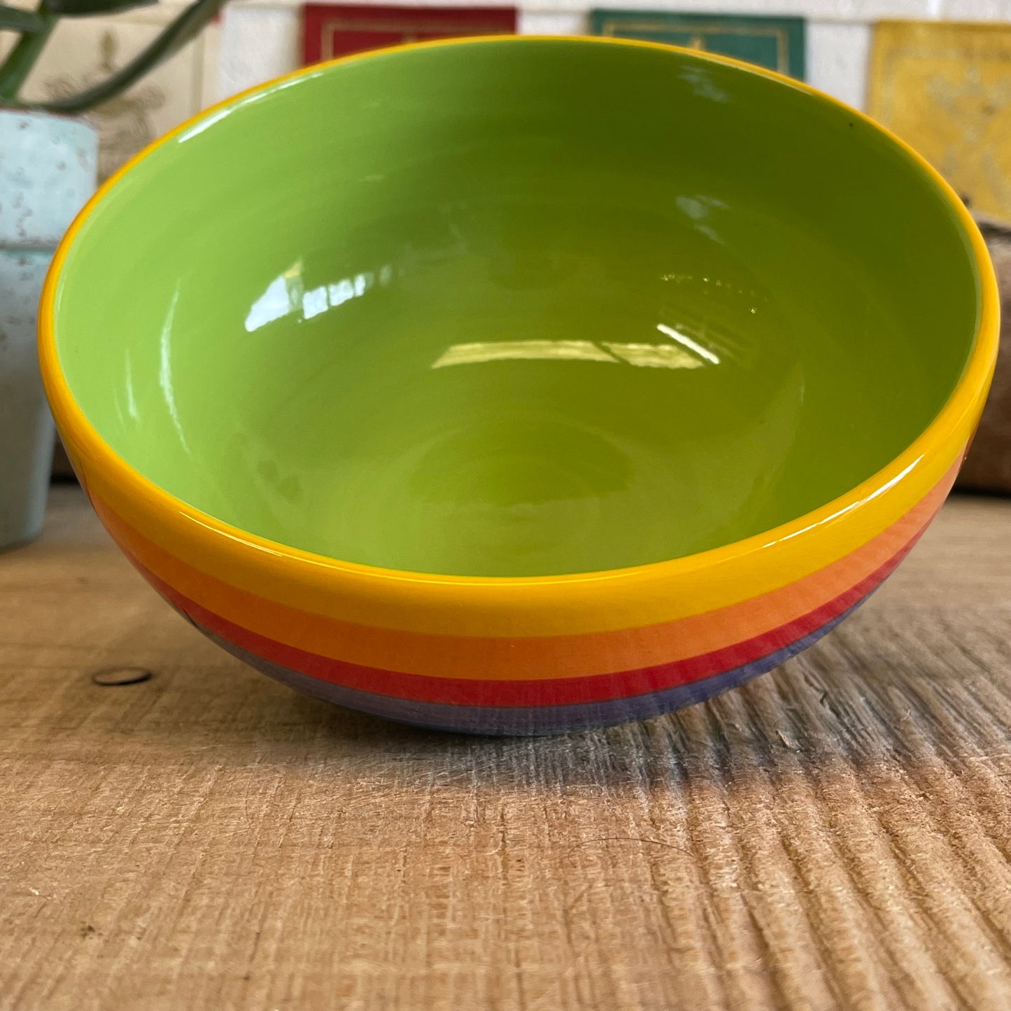 Wonderfully cheerful happy &amp; bright, this rainbow stripe ceramic bowl brightens up any home. The vibrant stripes are hand painted giving each piece individual character.  Size: 15 x 7cm  Handmade and Fairtrade from Thailand  Dishwasher and Microwave safe  Note: As these side plates are hand painted slight variations in pattern and colour can occur.