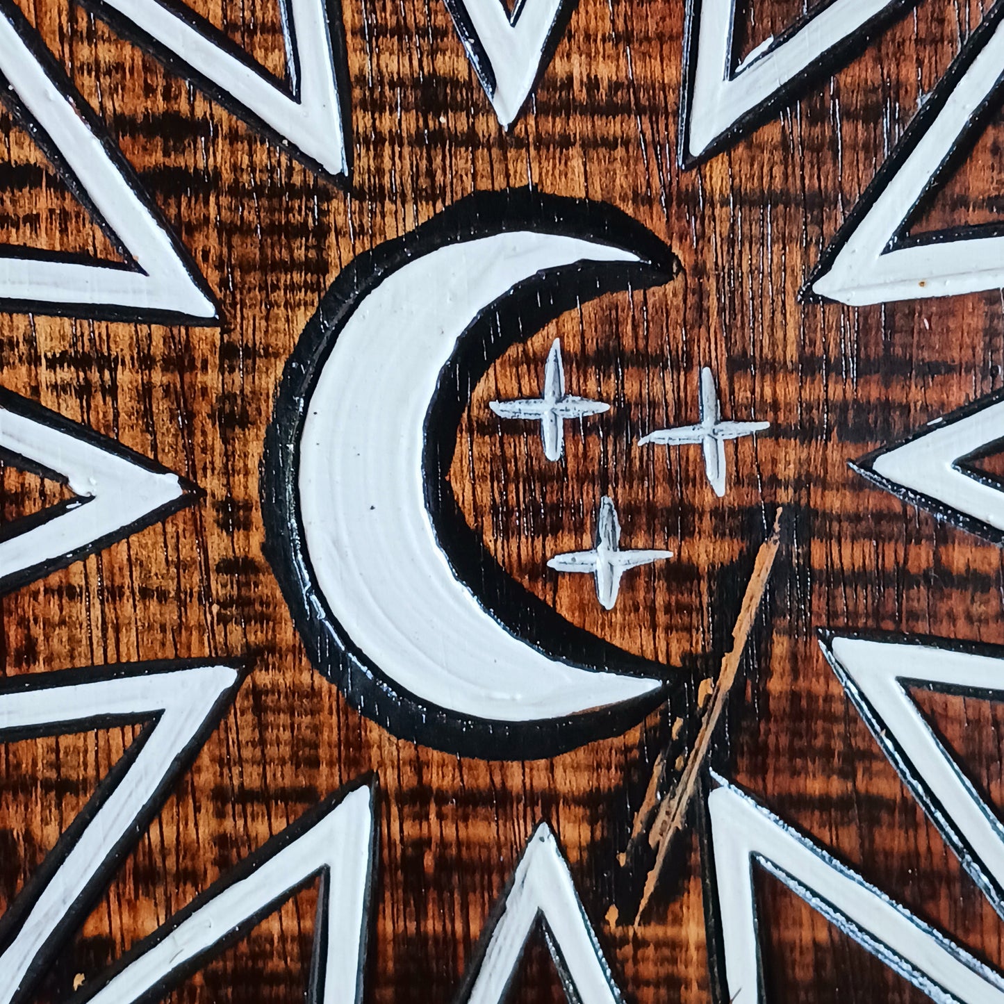 Hand carved and hand painted, this wooden wall plaque features a crescent moon and zodiac symbols design. A unique plaque for your garden.