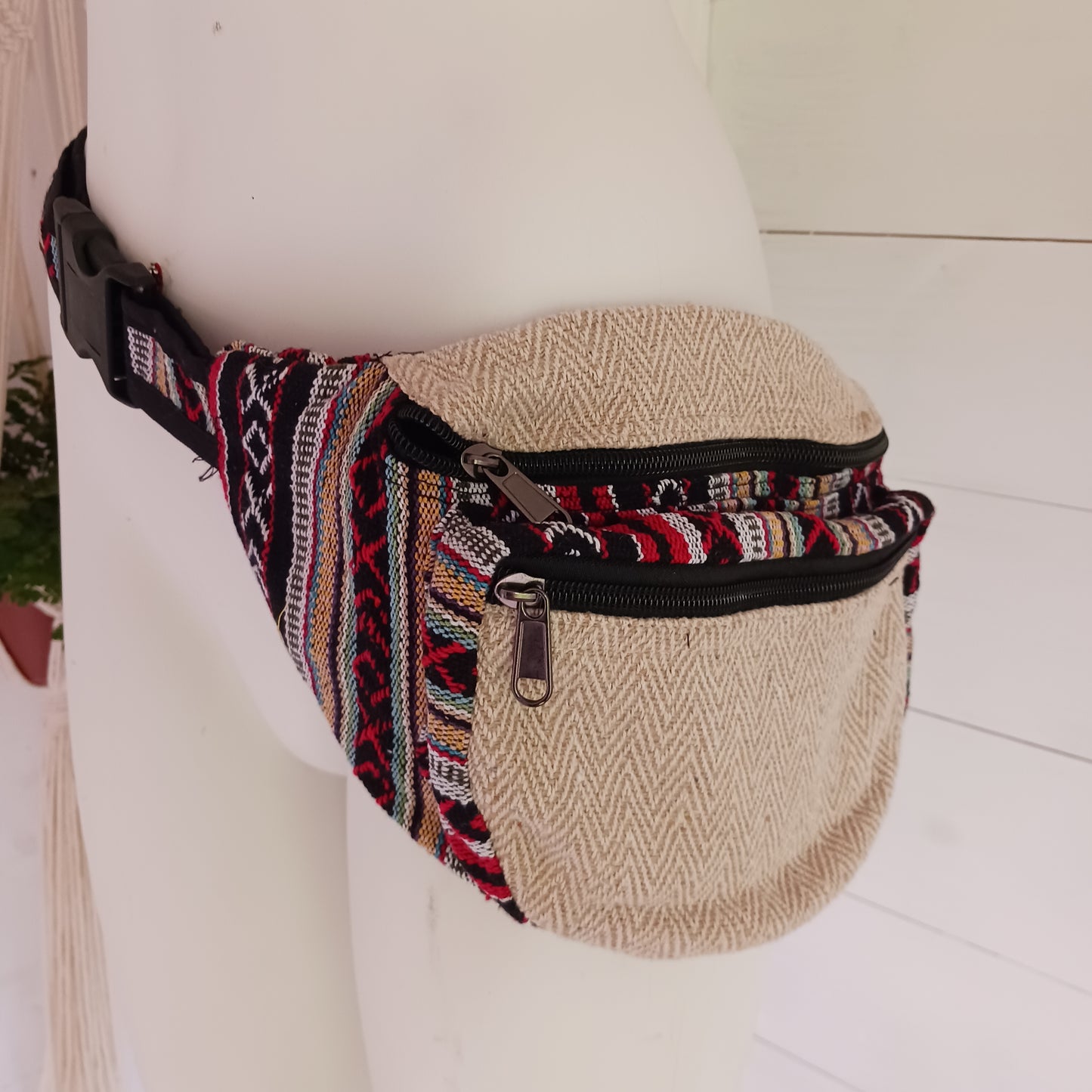 These brilliant bum bags are the perfect bit of kit for festivals or travelling. Made from a hard wearing mix of hemp and bold, colourful gheri cotton, each bag has two large zipped compartments,&nbsp;a zipped inside note pocket and an adjustable waist strap.  Please be aware that our patchwork products are made using up scraps of fabric that would otherwise be wasted. This means that each item is unique.