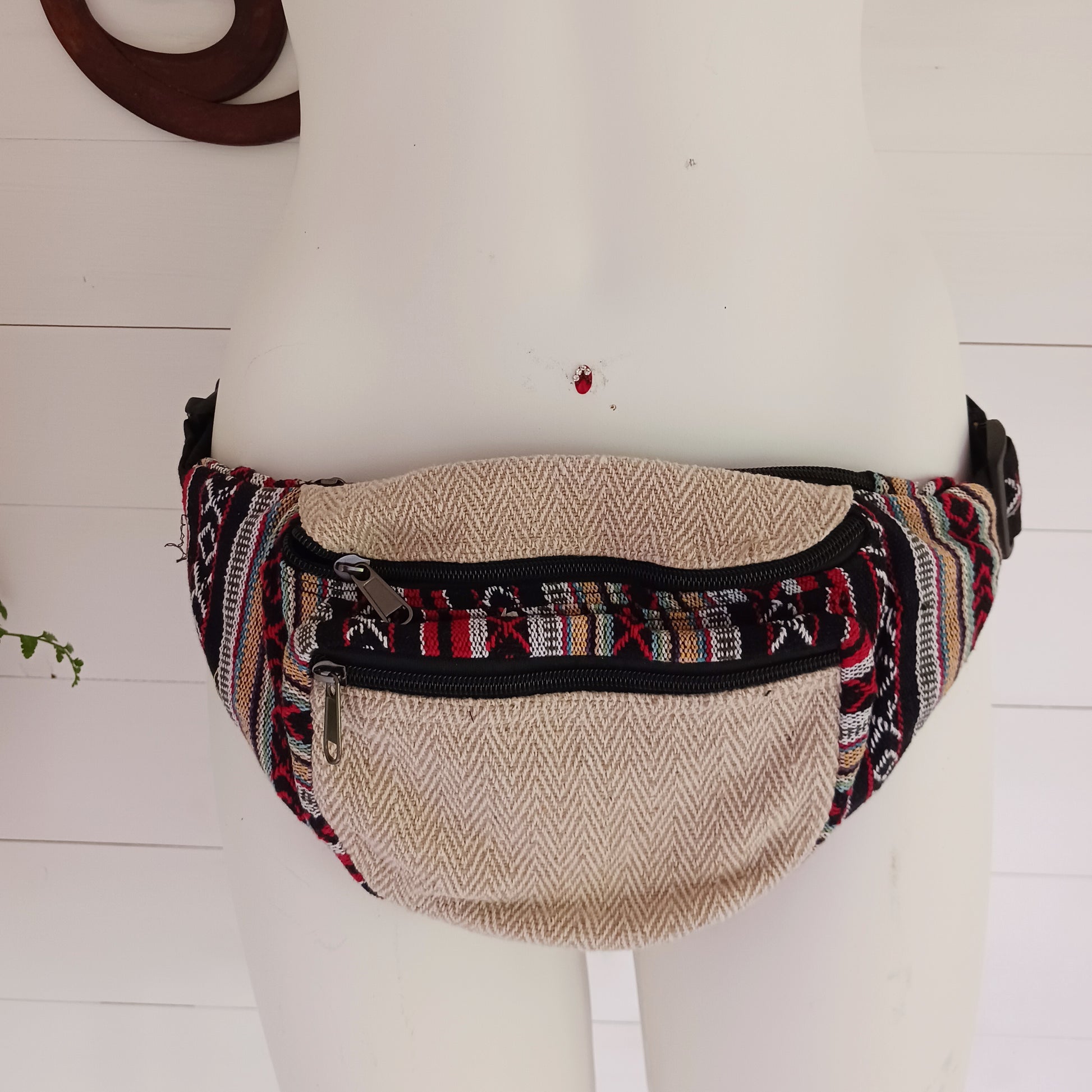 These brilliant bum bags are the perfect bit of kit for festivals or travelling. Made from a hard wearing mix of hemp and bold, colourful gheri cotton, each bag has two large zipped compartments,&nbsp;a zipped inside note pocket and an adjustable waist strap.  Please be aware that our patchwork products are made using up scraps of fabric that would otherwise be wasted. This means that each item is unique.