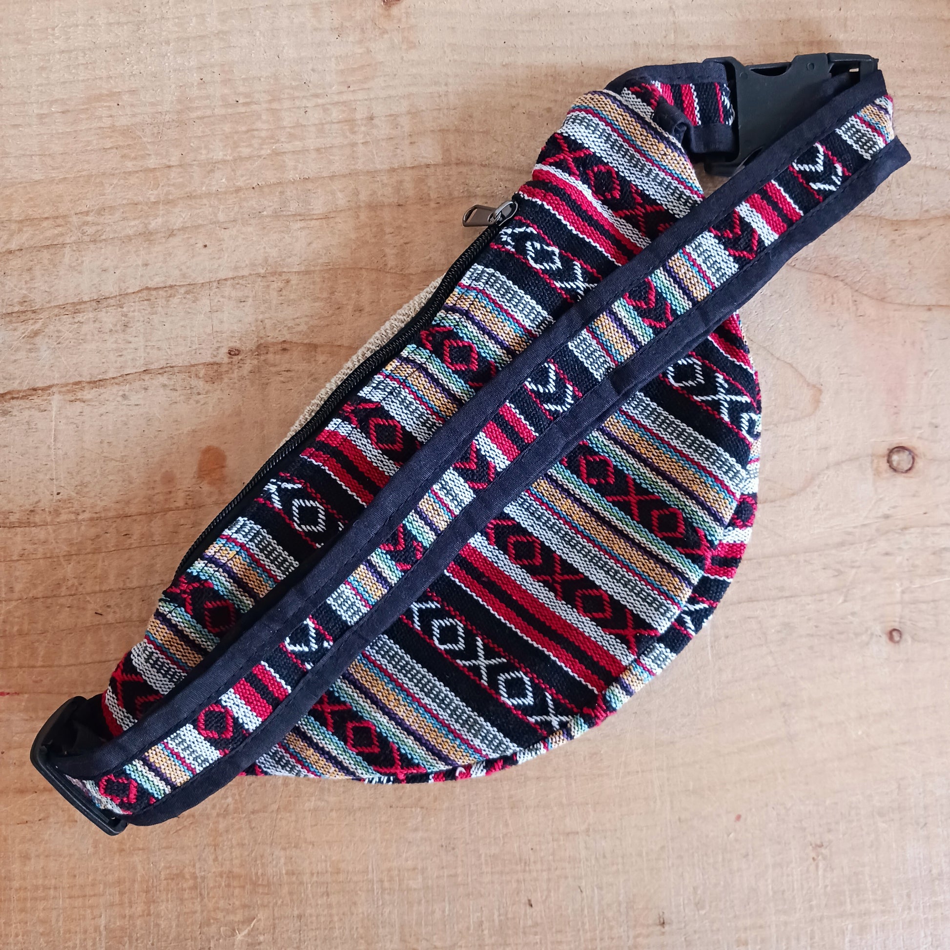 These brilliant bum bags are the perfect bit of kit for festivals or travelling. Made from a hard wearing mix of hemp and bold, colourful gheri cotton, each bag has two large zipped compartments,&nbsp;a zipped inside note pocket and an adjustable waist strap.  Please be aware that our patchwork products are made using up scraps of fabric that would otherwise be wasted. This means that each item is unique.