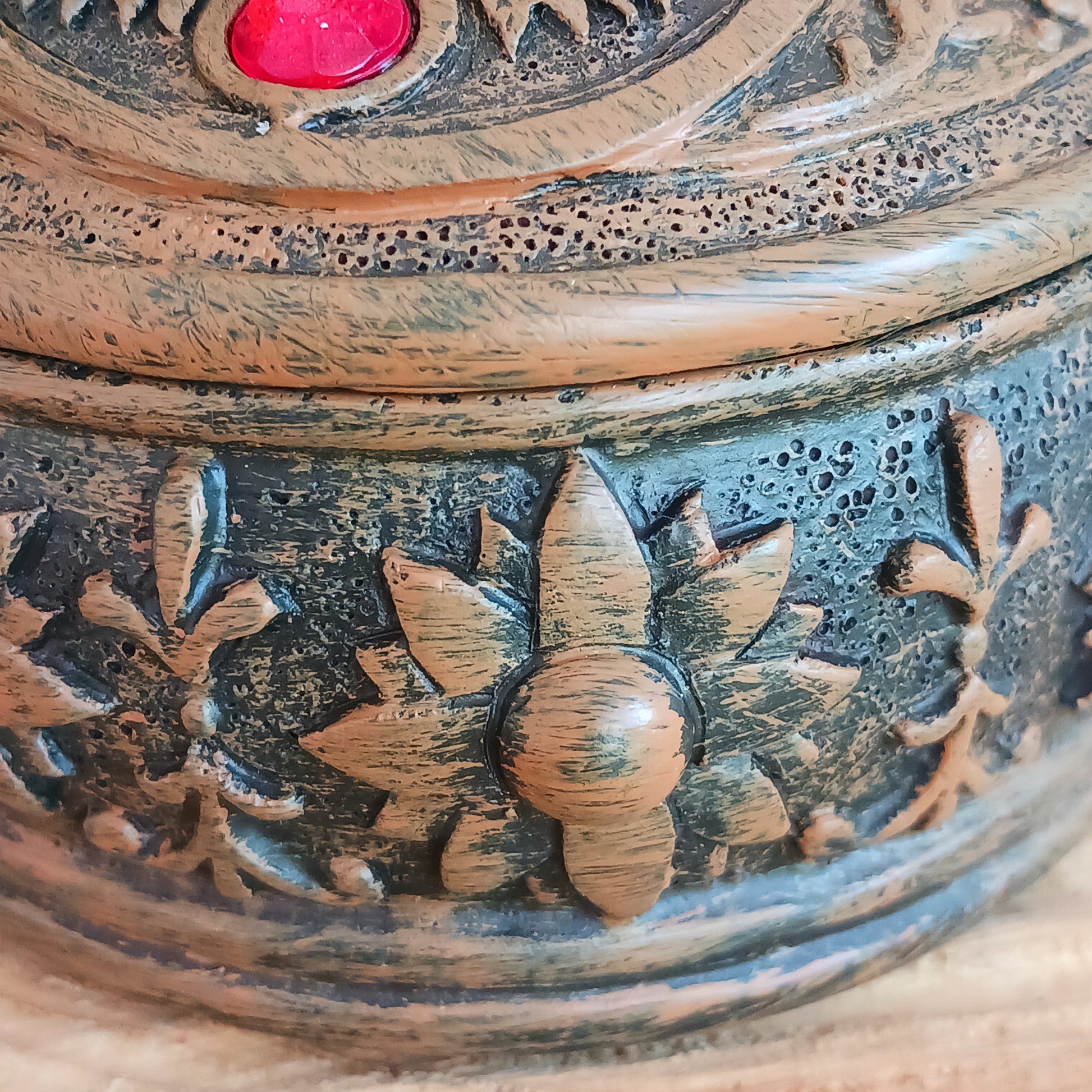 This beautiful Charka Box features Hamsa's Hand which is known for offering protection and happiness to its owners, you can rest assured that your most prized possessions are safe from prying eyes.  With engraved flowers and patterns around the side of the box, and finished with coloured gemstones on the top of the lid. This piece is perfect for anyone who needs a little protection in their life.