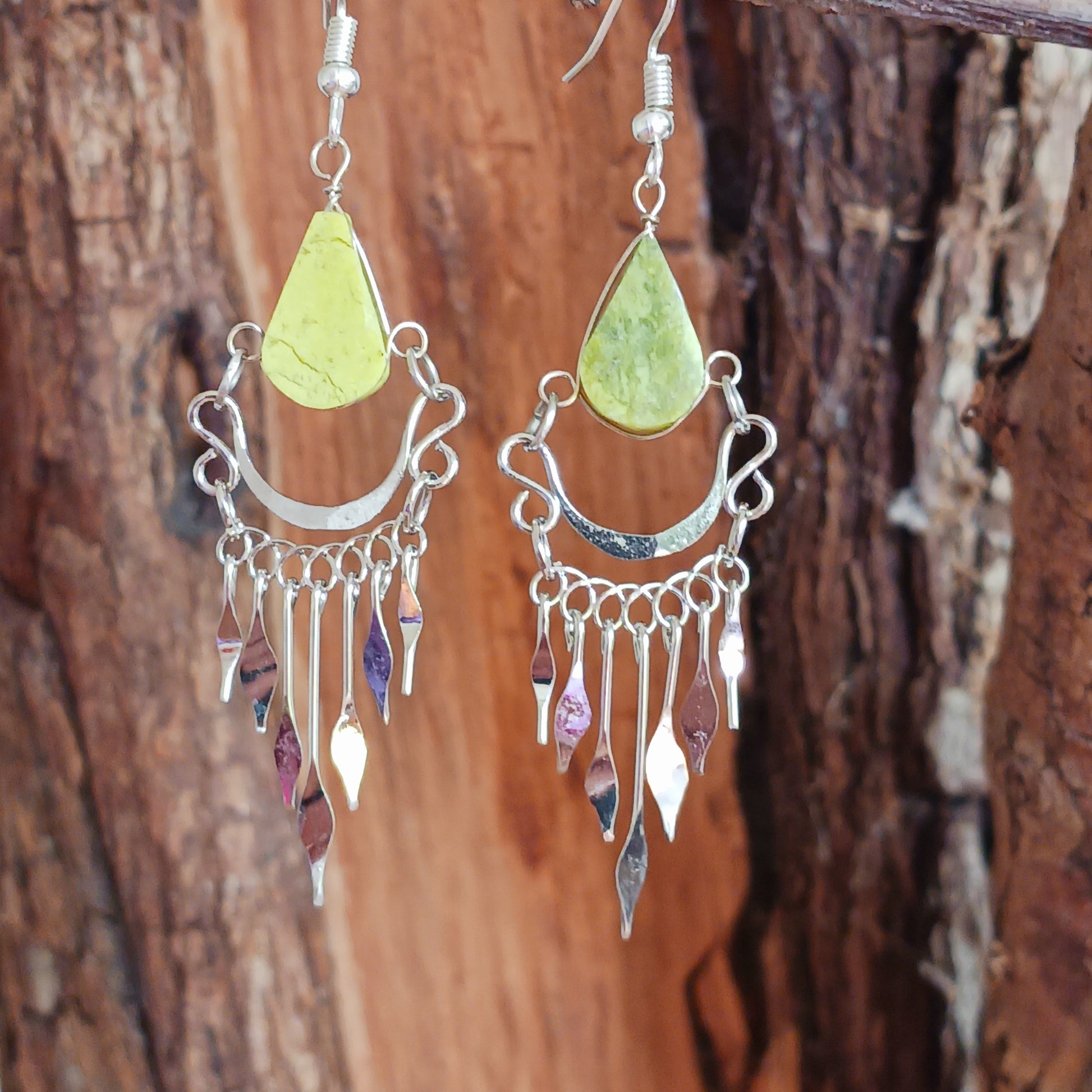 These beautiful hoop earrings incorporate a light green stone with Silver plated hooks. They have been hand made in Peru and are presented in a traditionally made pouch gift wrapped and ready to give