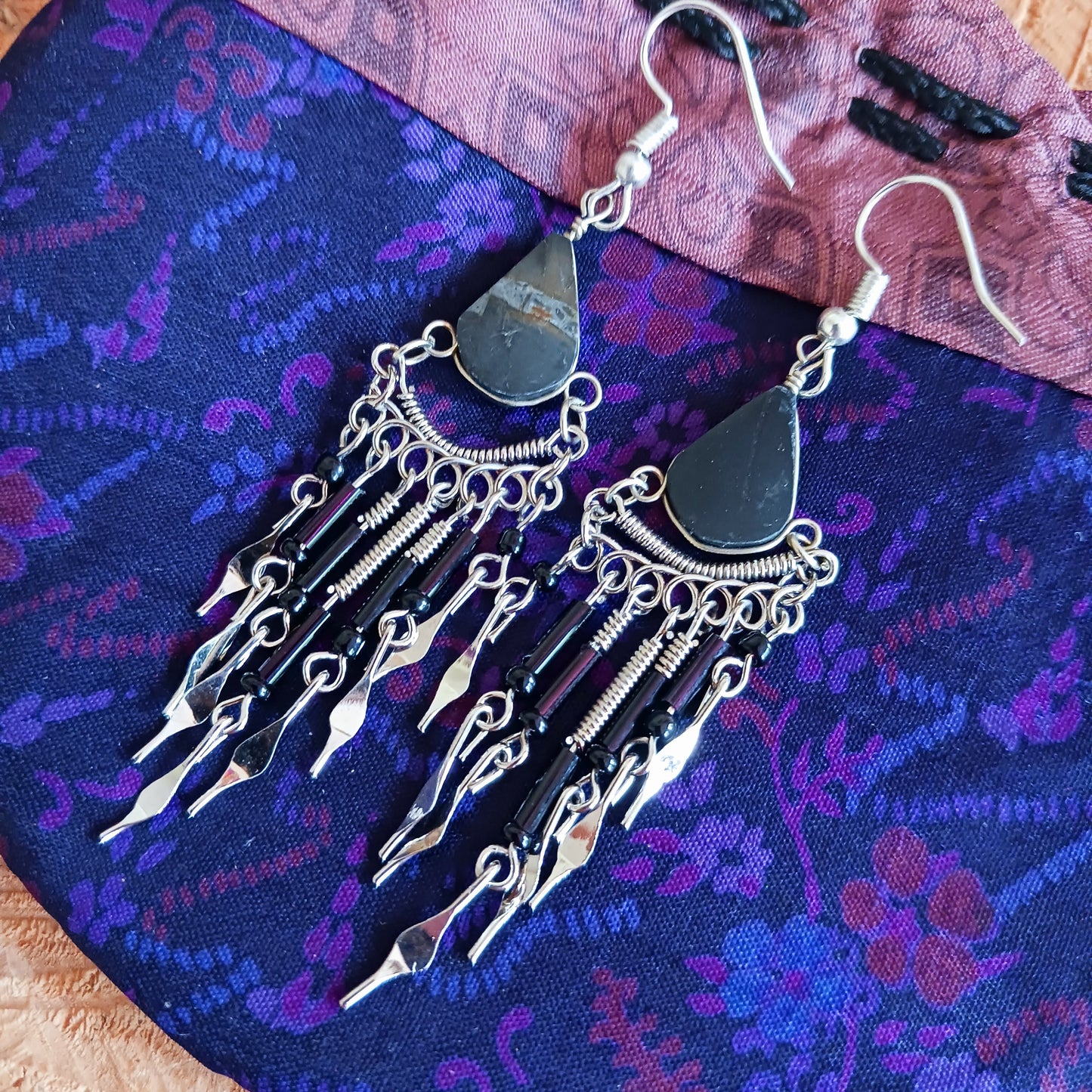 These beautiful earrings incorporate Black Tourmaline Stone with Silver plated hooks. They have been hand made in Peru and are presented in a traditionally made pouch, gift wrapped and ready to give