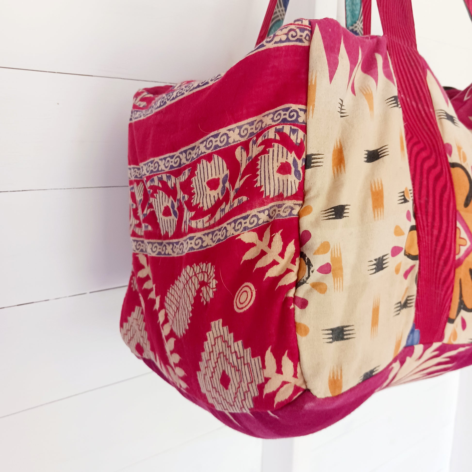 This summer holdall is an attractive accessory for weekends away with generous length handles, a zipped top and a useful front zipped pocket for mobile and keys. Each bag is one of a kind!