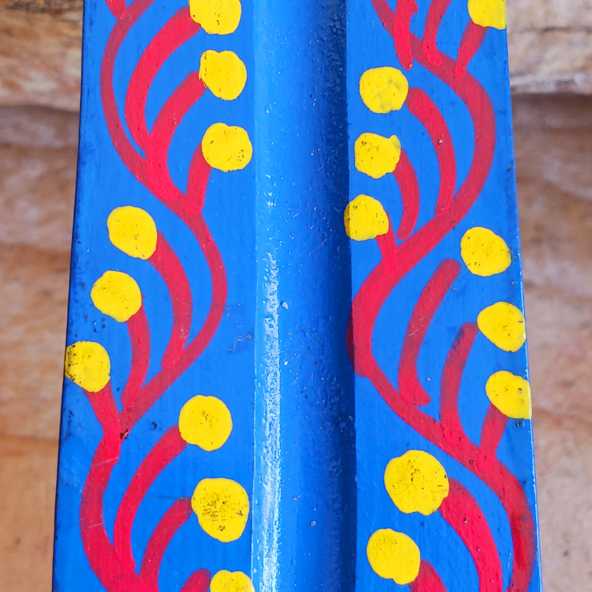 A classic shaped incense holder handmade from sustainable mango wood and hand painted in colourful Indian Truck Art designs. It has a single end incense stick holder at one end. A lovely ornamental piece of Indian décor and a nice gift item.