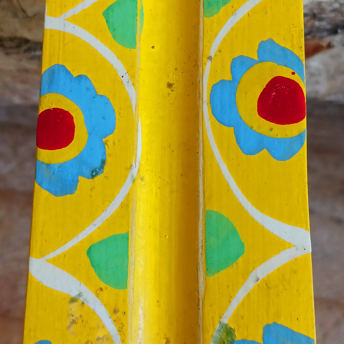 A classic shaped incense holder handmade from sustainable mango wood and hand painted in colourful Indian Truck Art designs. It has a single end incense stick holder at one end. A lovely ornamental piece of Indian décor and a nice gift item.