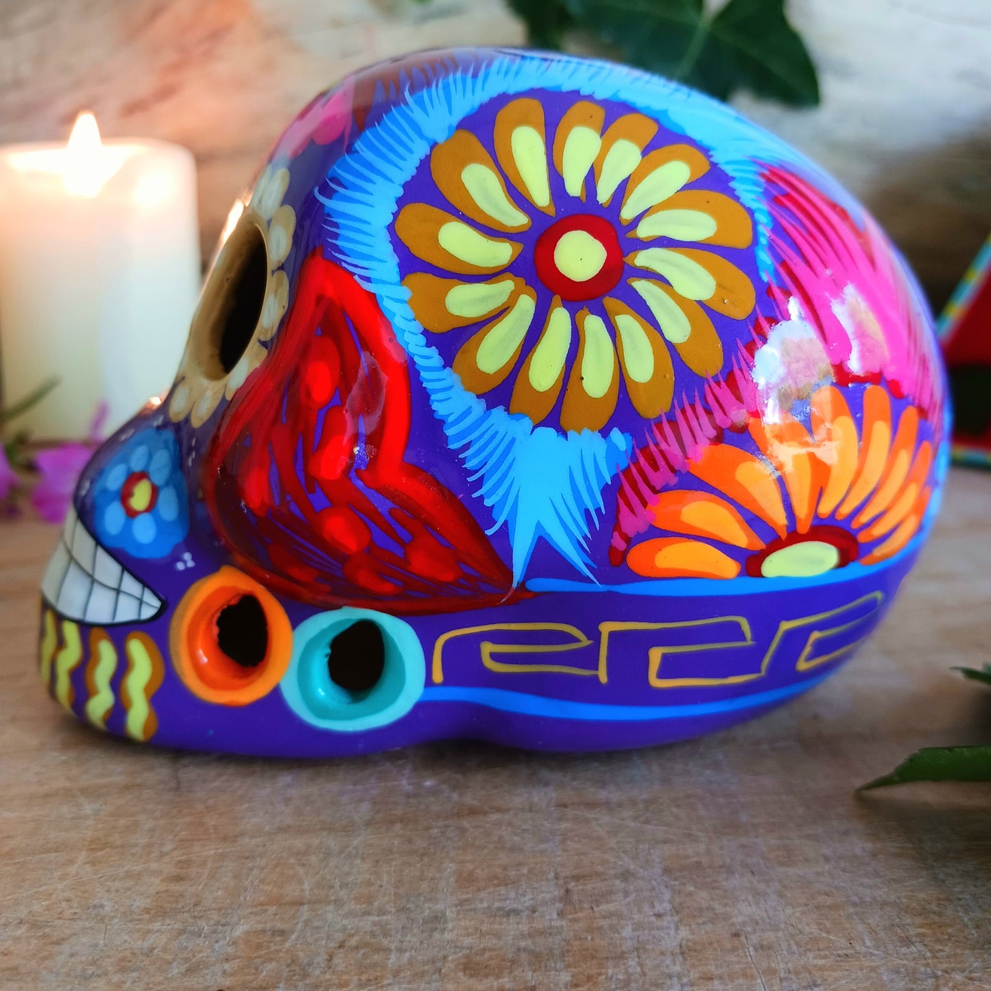 These fun ceramic sugar skull ornaments have been beautifully painted in bright colours and finished with a high shine glaze.&nbsp;

They are a popular item during Día de Los Muertos or Day of the Dead festivities, held in Mexico every November to celebrate welcoming the souls of their deceased relatives back for a time of food, drink and celebration.

These skulls are also make a bright edition to any home.