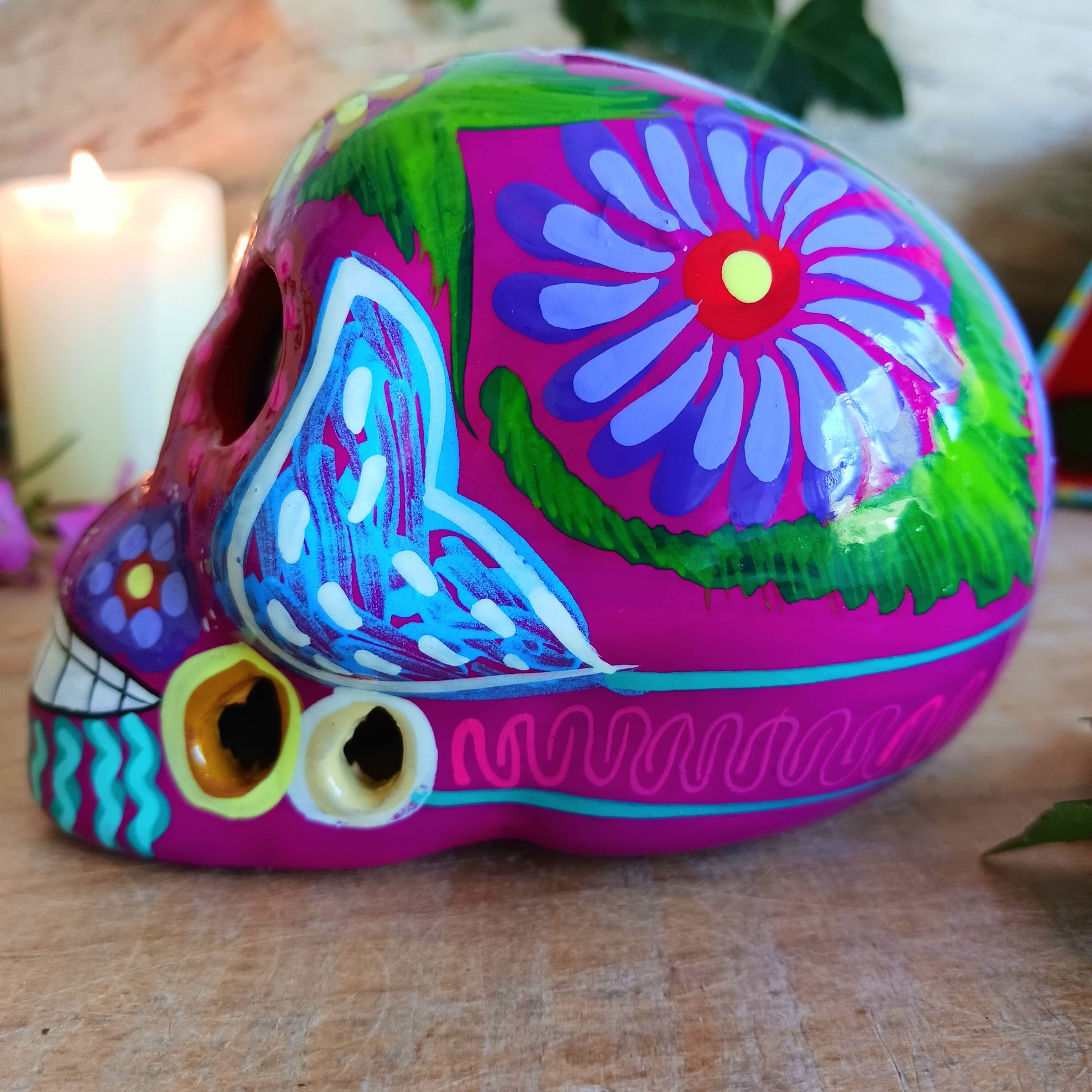 These fun ceramic sugar skull ornaments have been beautifully painted in bright colours and finished with a high shine glaze.&nbsp;

They are a popular item during Día de Los Muertos or Day of the Dead festivities, held in Mexico every November to celebrate welcoming the souls of their deceased relatives back for a time of food, drink and celebration.