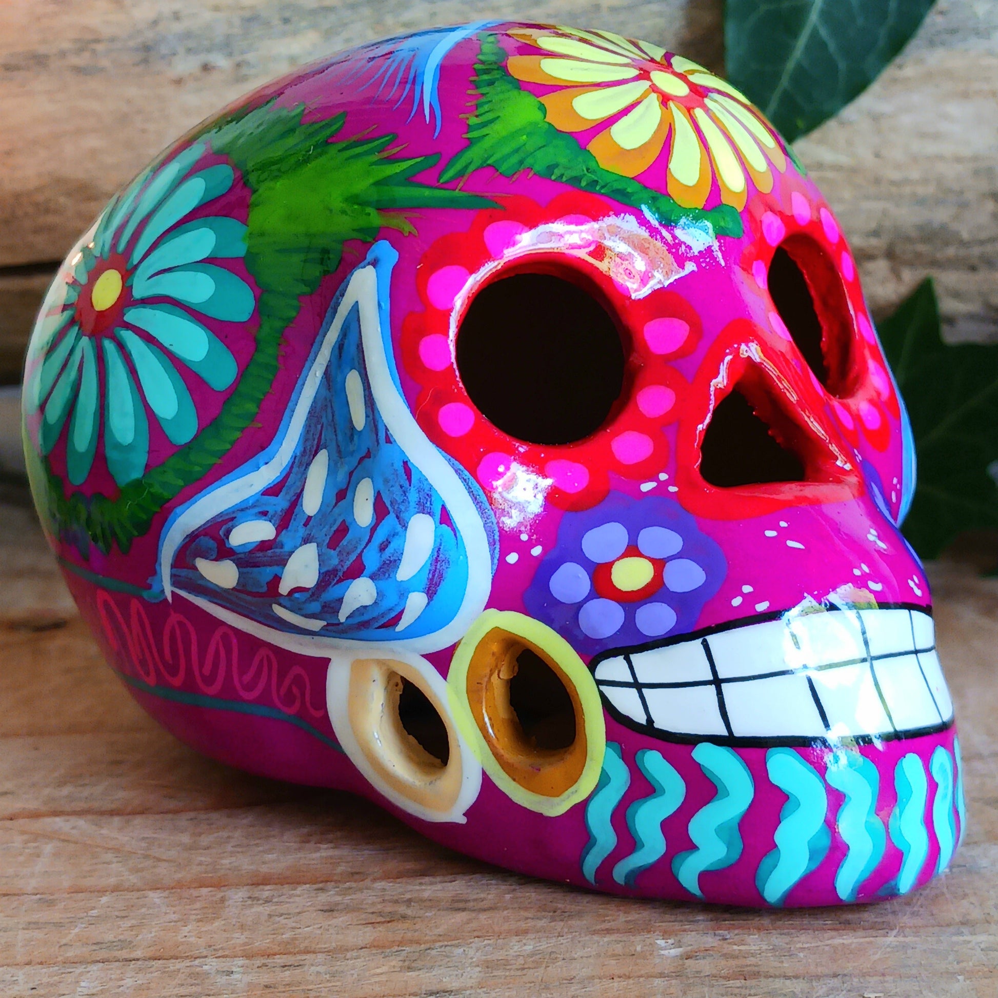 These fun ceramic sugar skull ornaments have been beautifully painted in bright colours and finished with a high shine glaze.&nbsp;

They are a popular item during Día de Los Muertos or Day of the Dead festivities, held in Mexico every November to celebrate welcoming the souls of their deceased relatives back for a time of food, drink and celebration.