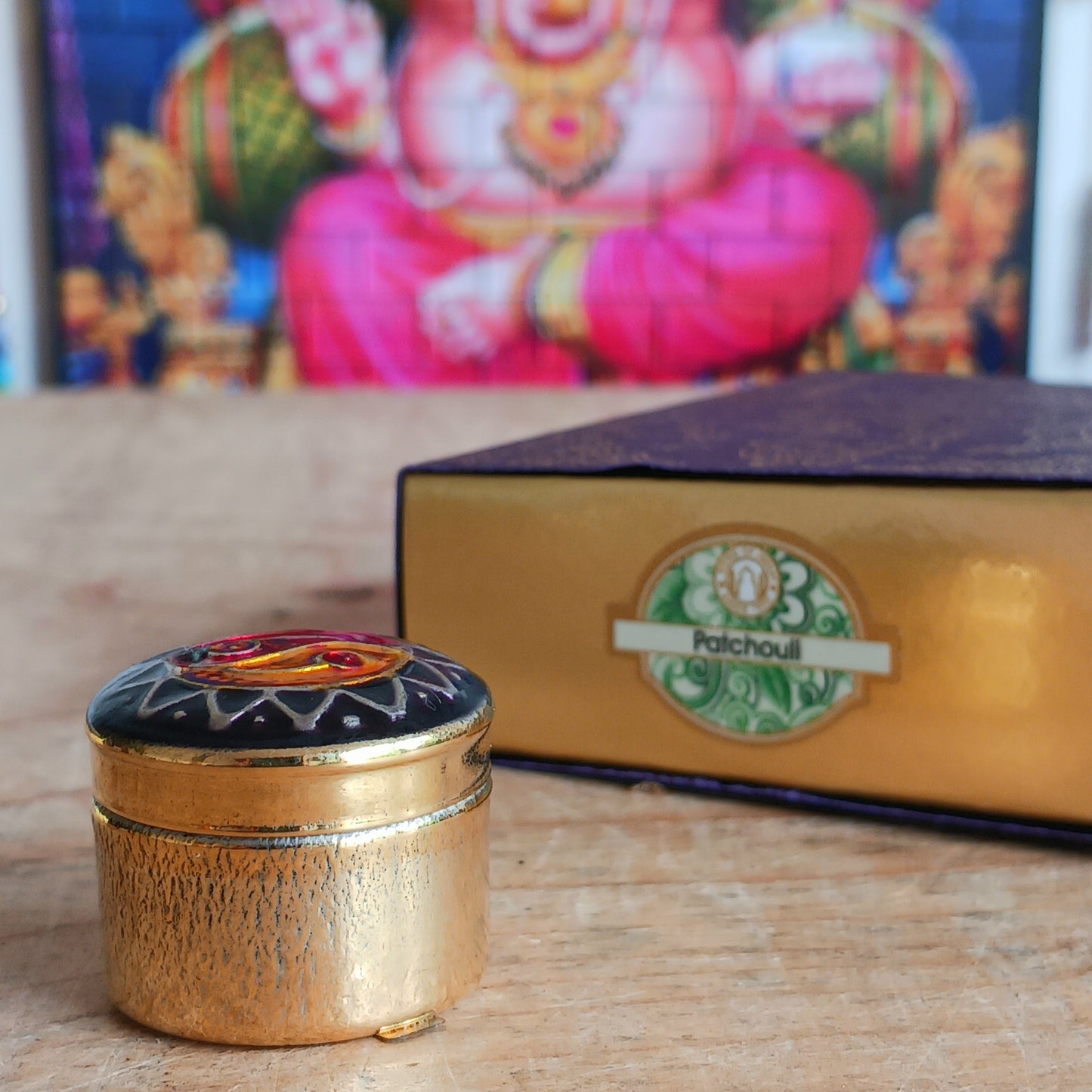 Natural solid Song of India Patchouli fragrance cream presented in a beautiful small brass cloisonné tin, makes an ideal gift for family and friends.